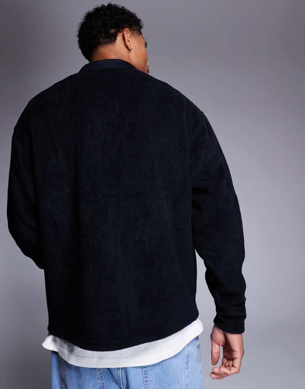 ASOS DESIGN oversized rugby polo fleece sweatshirt with quarter zip in black Product Image