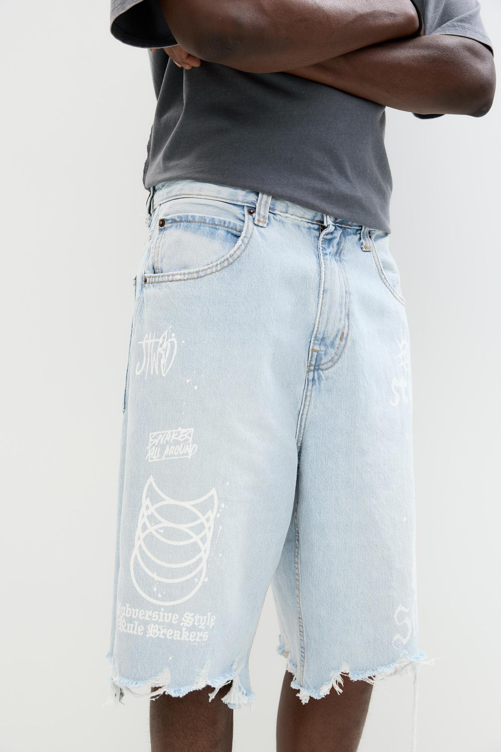 Ripped denim Bermuda shorts Product Image