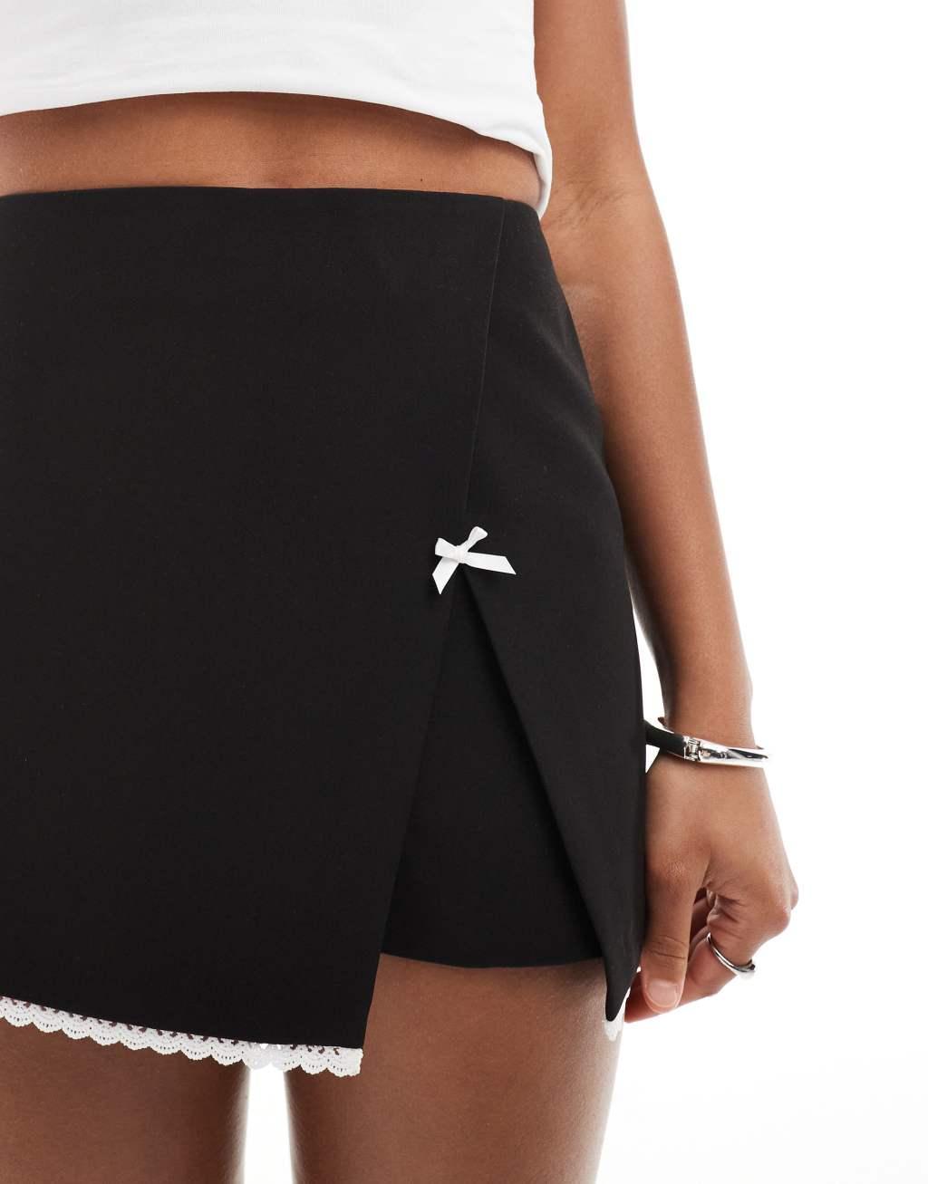 Miss Selfridge tailored mini skort with bow in black Product Image