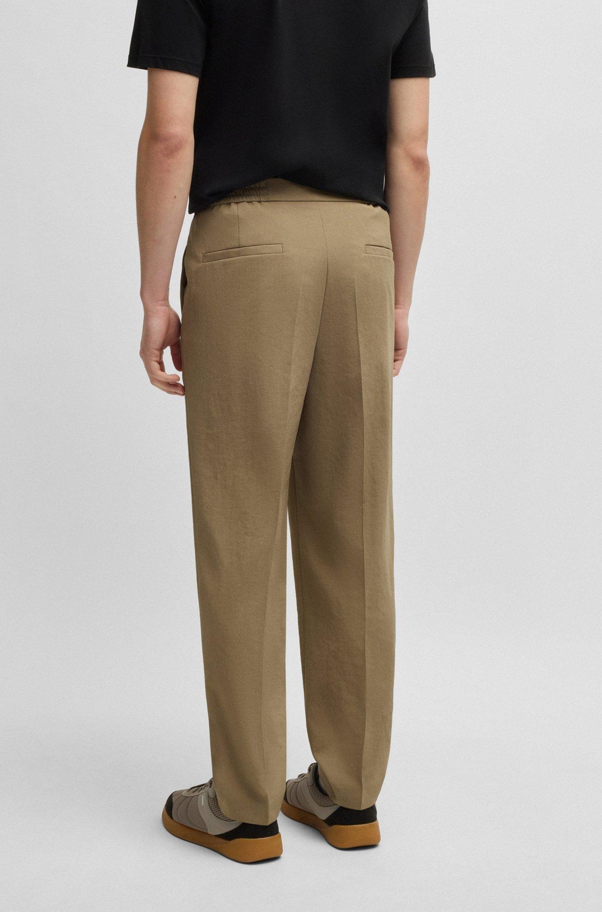 Slim-fit trousers in melange wrinkle-resistant fabric Product Image