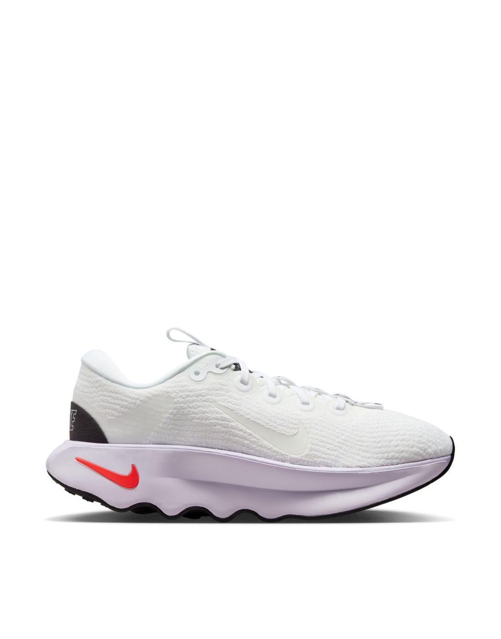 Nike Training Motiva sneakers in white and pink Product Image