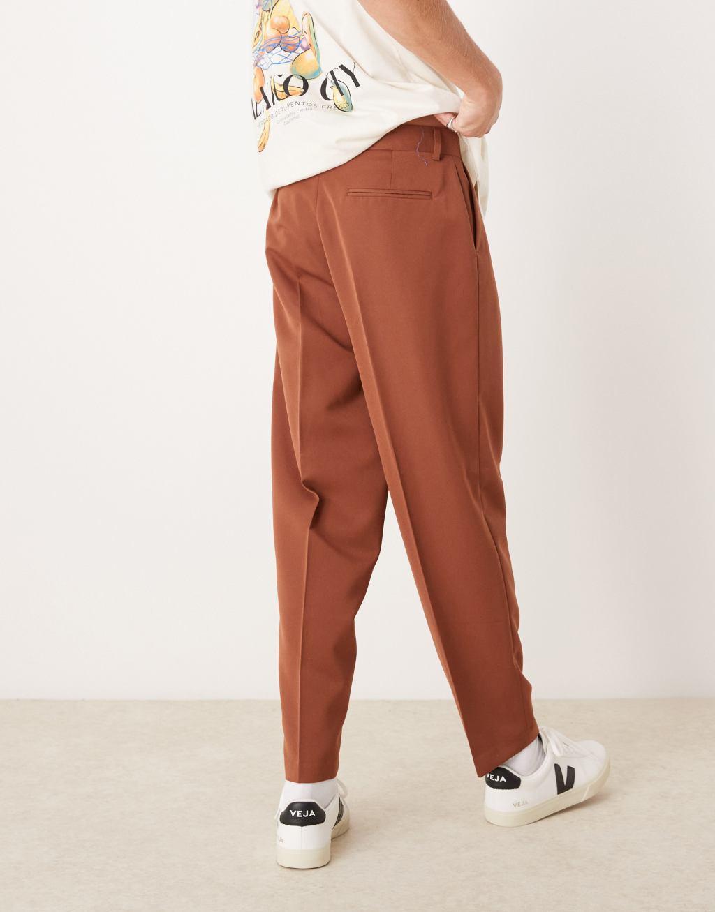 ASOS DESIGN oversized tapered dress pants with front pleat in rust Product Image