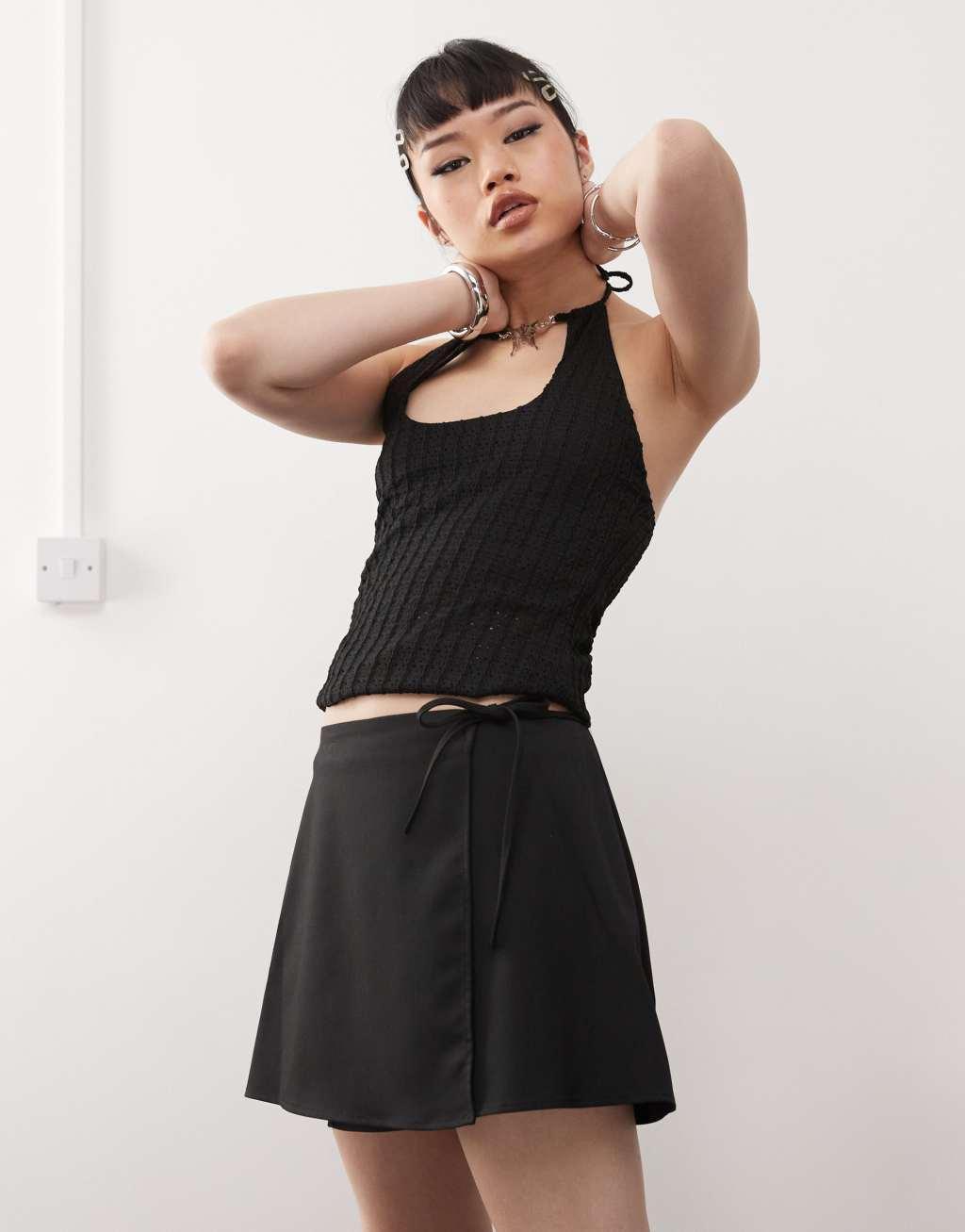 Monki mini wrap skirt in black Product Image