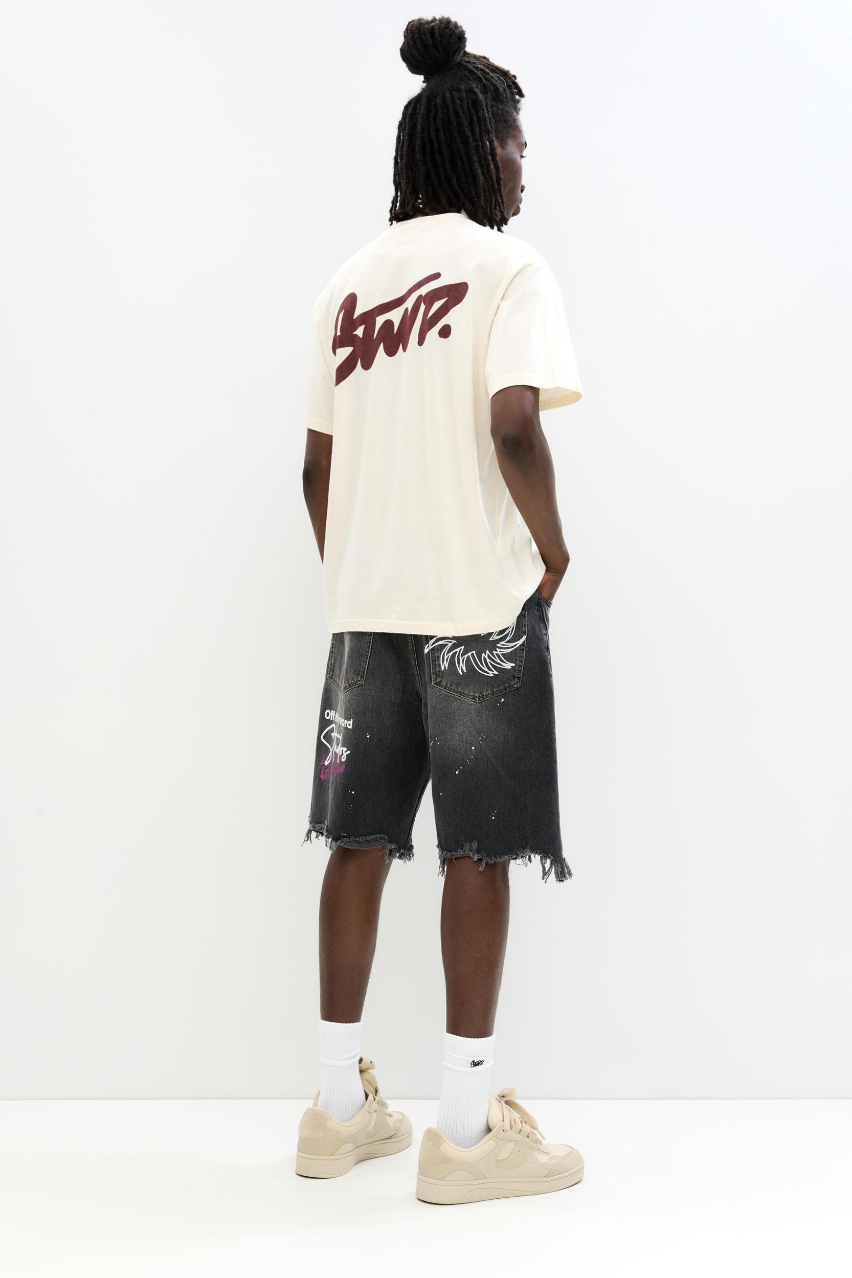 Ripped denim Bermuda shorts Product Image