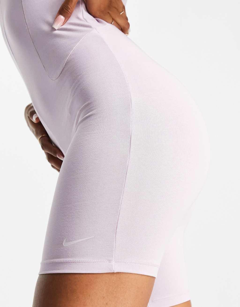 Nike Icon Clash romper unitard in pale purple Product Image