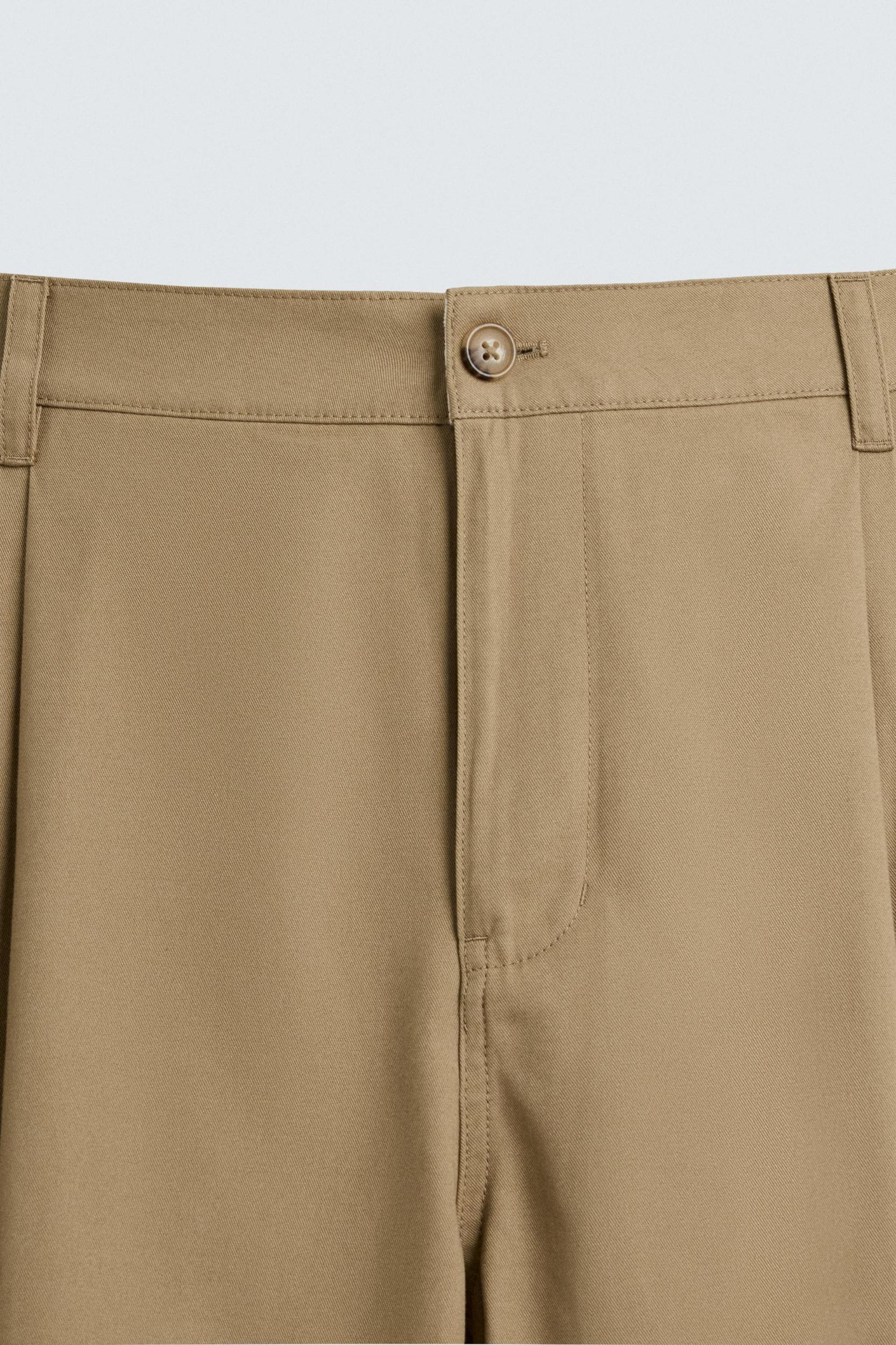 PLEATED WIDE FIT PANTS Product Image