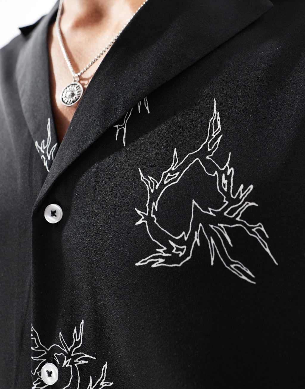 ASOS DESIGN boxy oversized deep revere shirt with heart print in black Product Image