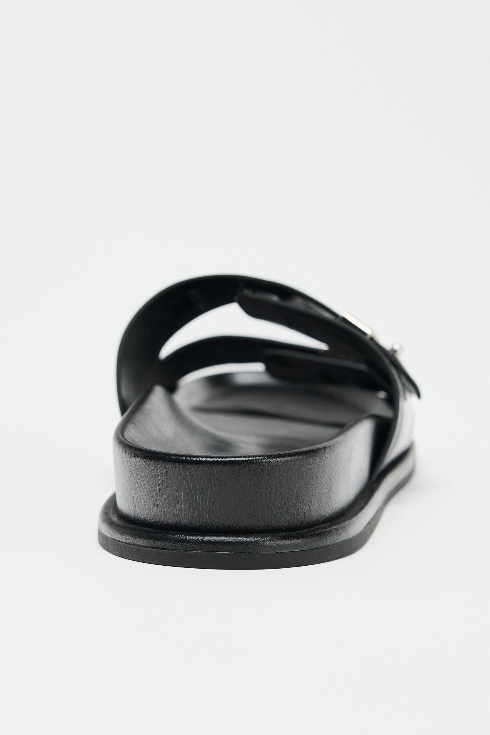 FLAT SANDALS WITH METALLIC DETAILS Product Image