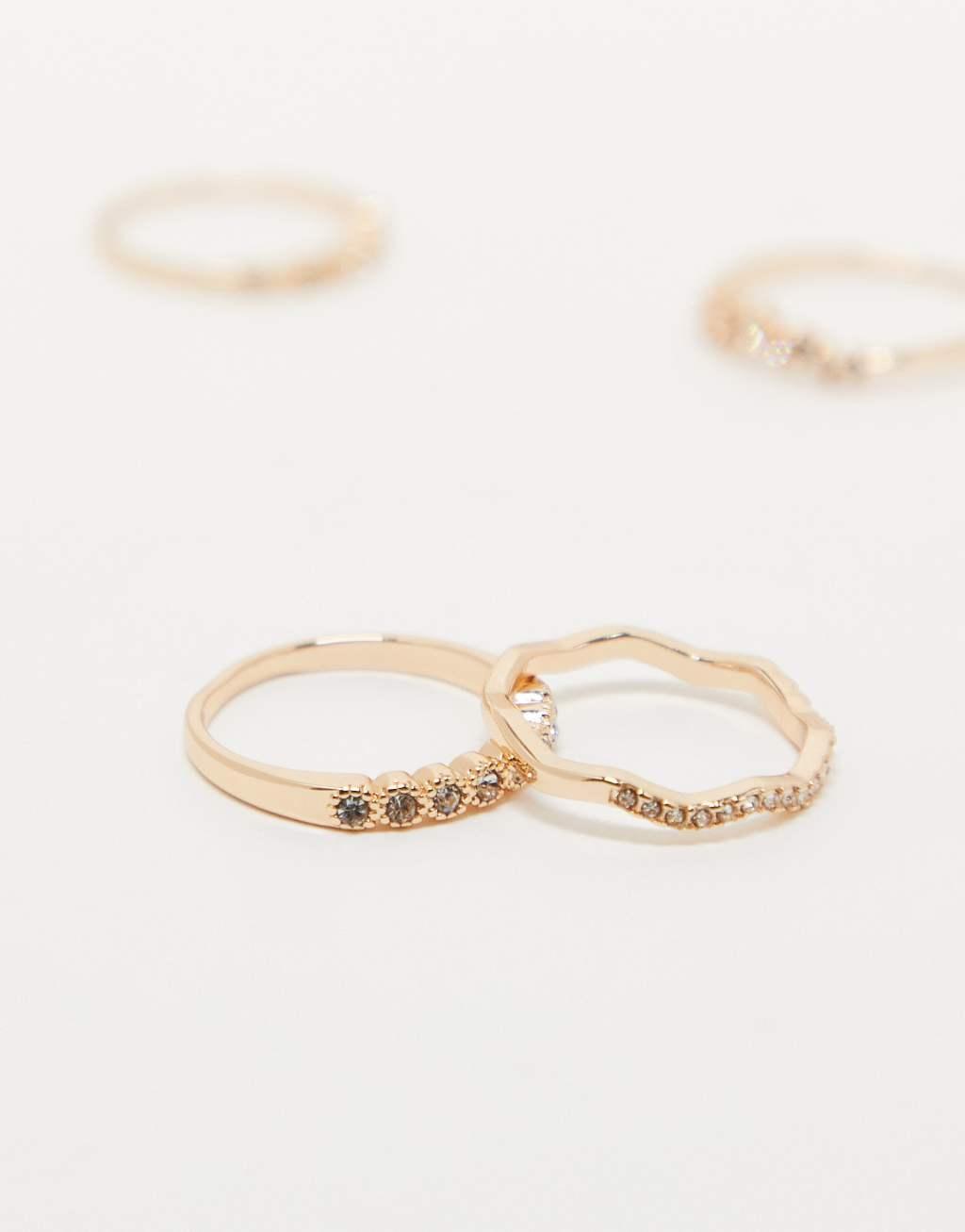 ASOS DESIGN pack of 4 rings with delicate crystal detail in gold tone Product Image