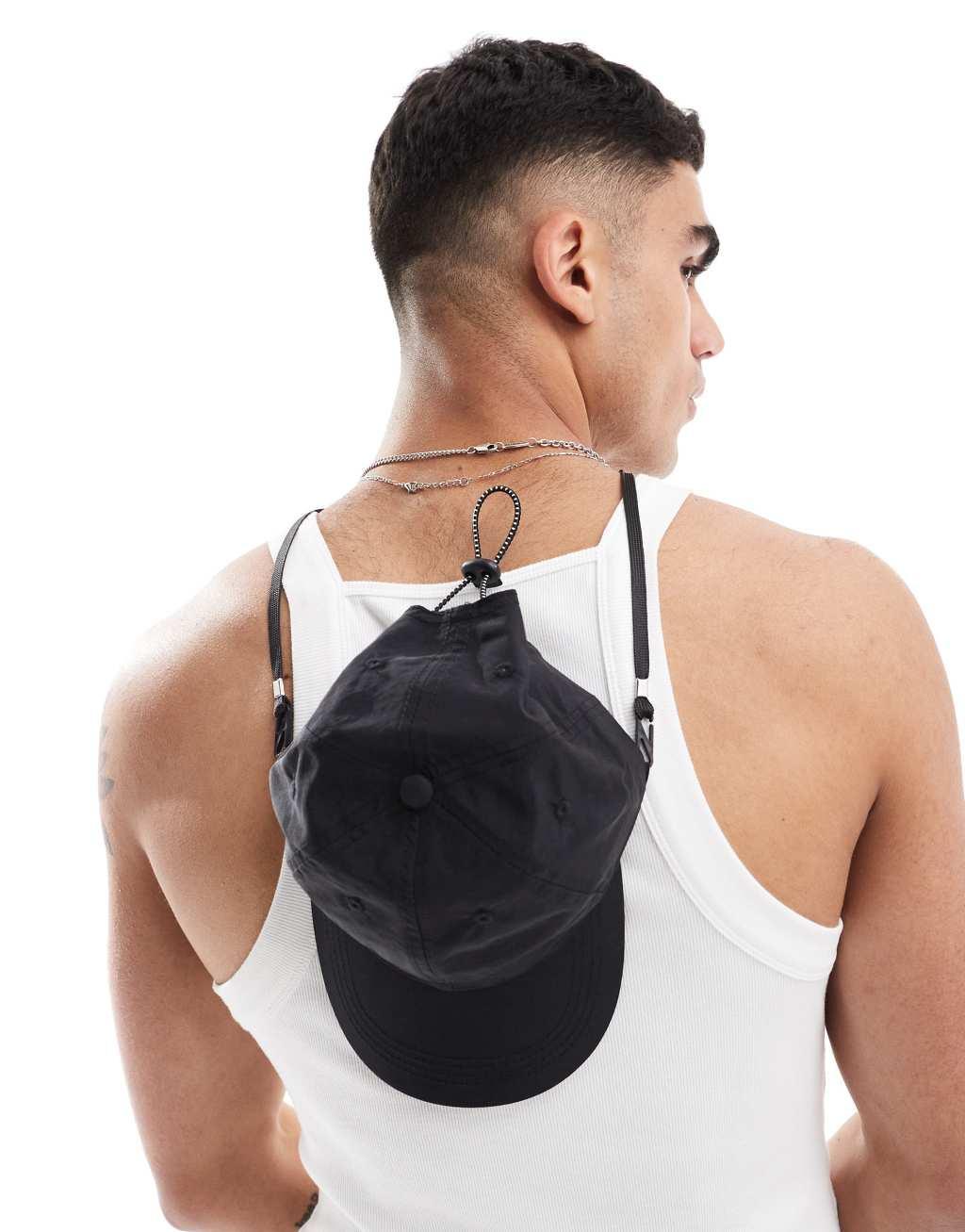 ASOS DESIGN nylon cap with drawstring in black Product Image