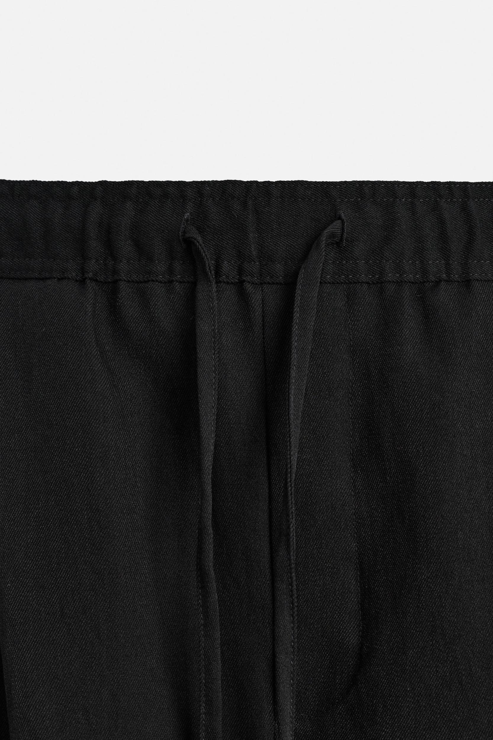 PLEATED FLOWY SHORTS Product Image