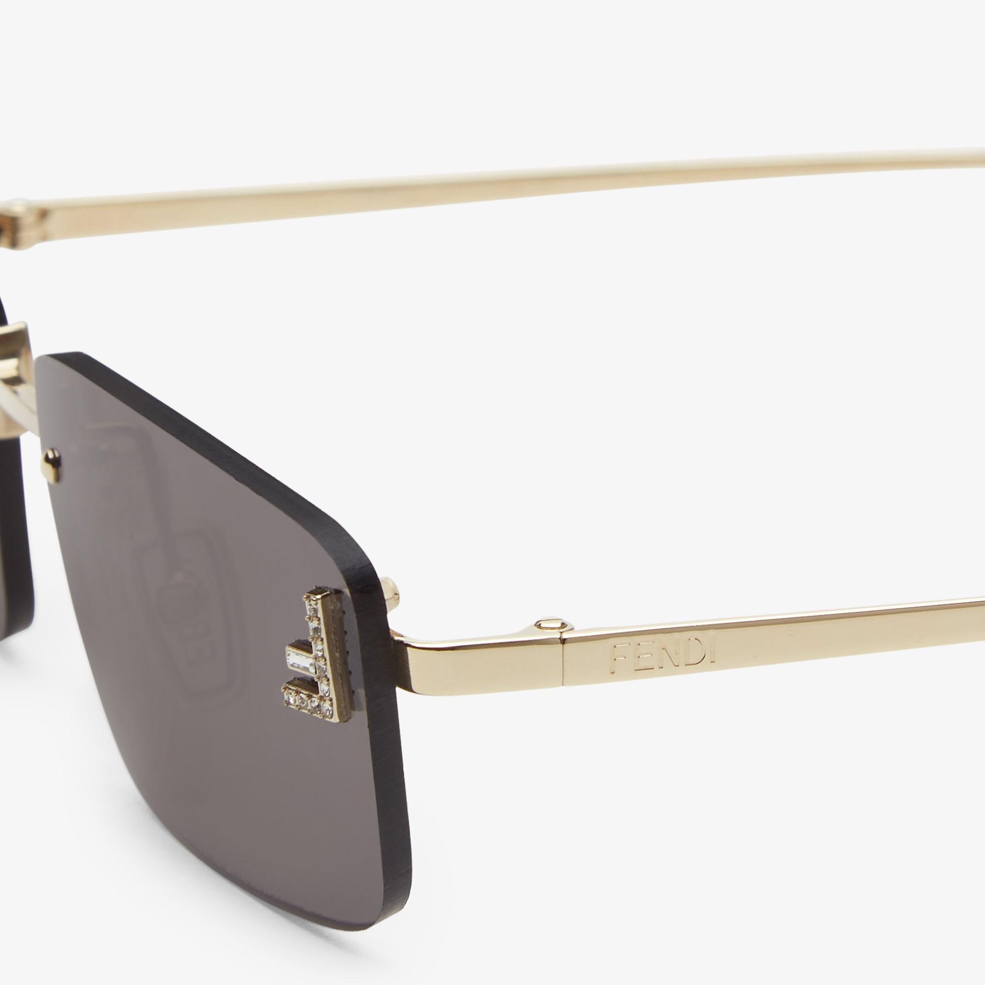 Fendi First CrystalGold-colored sunglasses with gray lenses Product Image