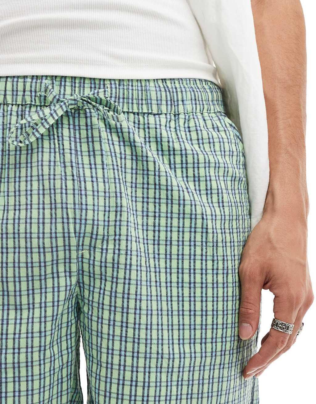 ASOS DESIGN textured shorts in check in green Product Image