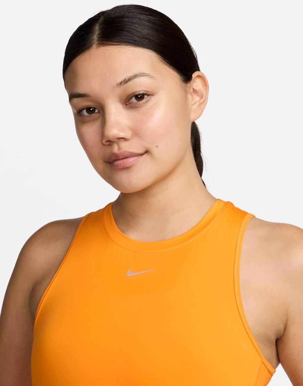 Nike One Training Dri-FIT cropped tank top in yellow Product Image