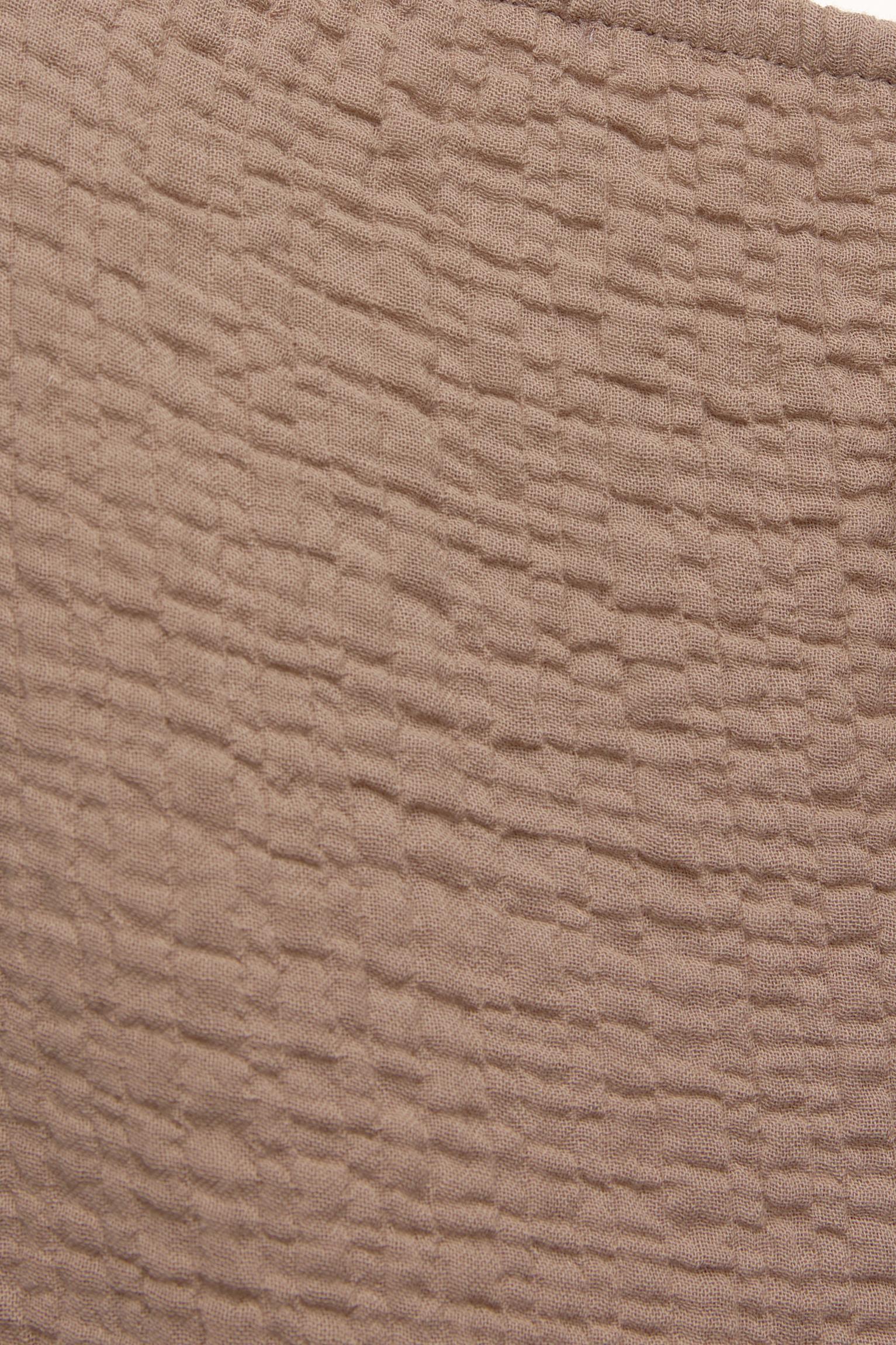 Rustic creased-effect pants Product Image