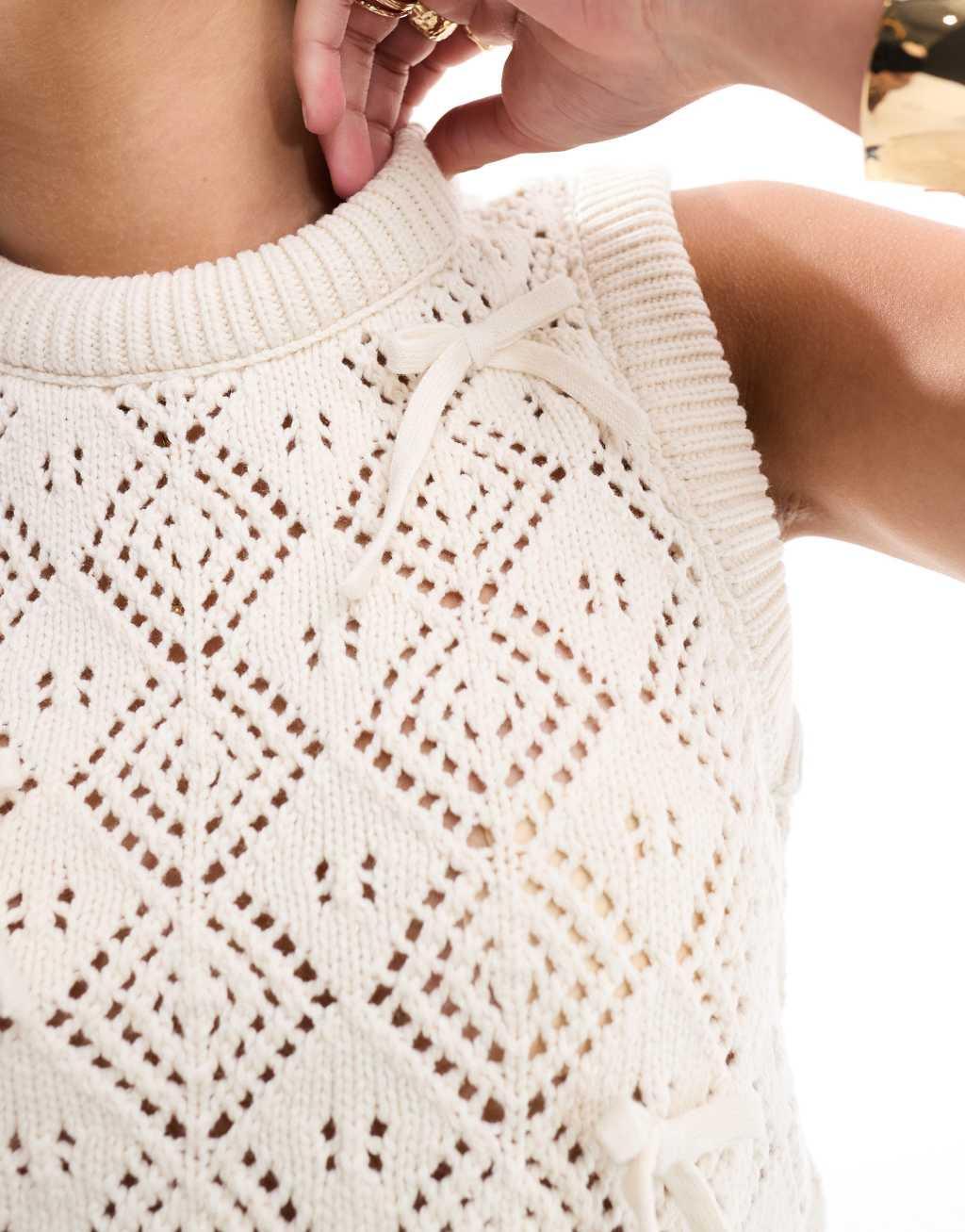 ASOS DESIGN knitted tank top in pointelle stitch with bow detail in cream Product Image