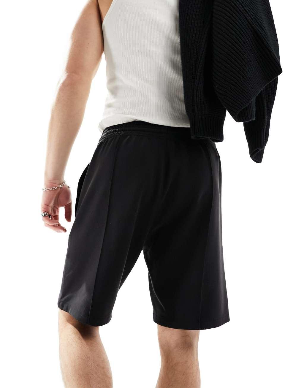 Weekday Ken relaxed fit shorts in black Product Image