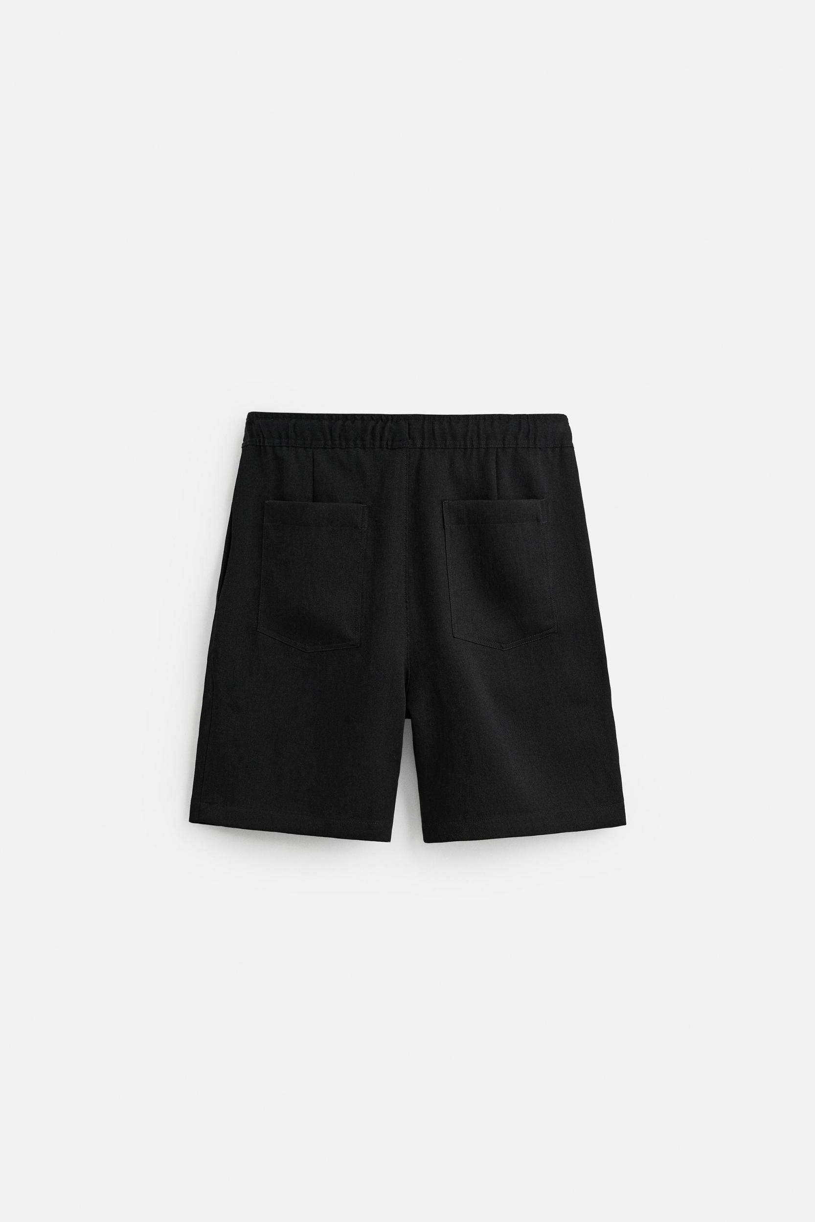 PLEATED FLOWY SHORTS Product Image