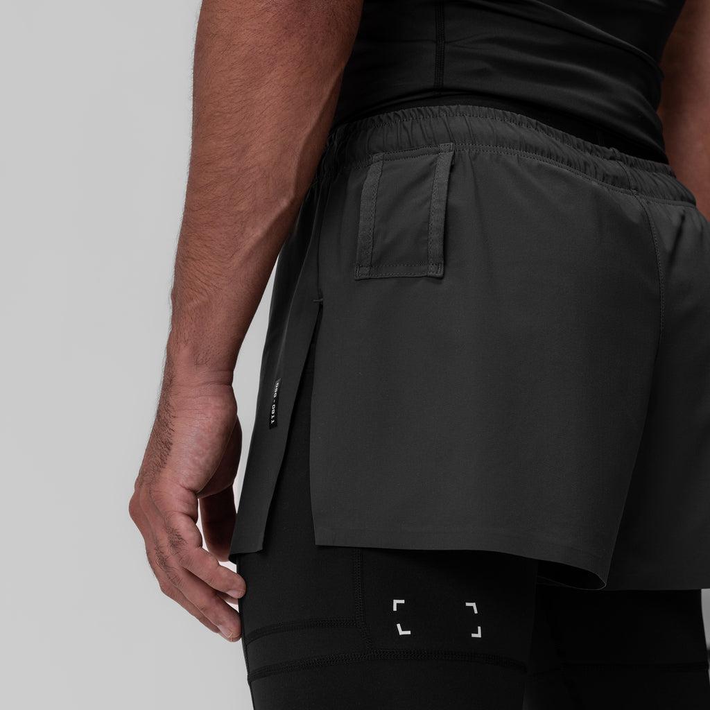 0911. Tetra-Lite® 2-in-1 High Split Legging Short - Black "Cyber"/Black Male Product Image