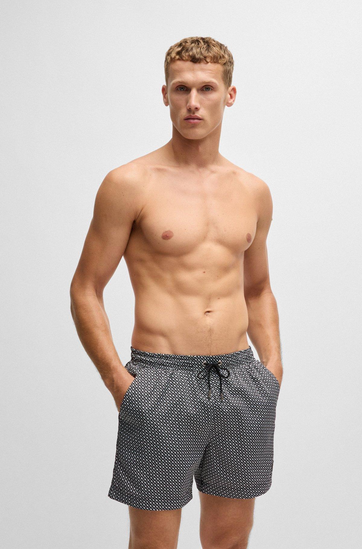 Monogram-print swim shorts in quick-dry fabric Product Image