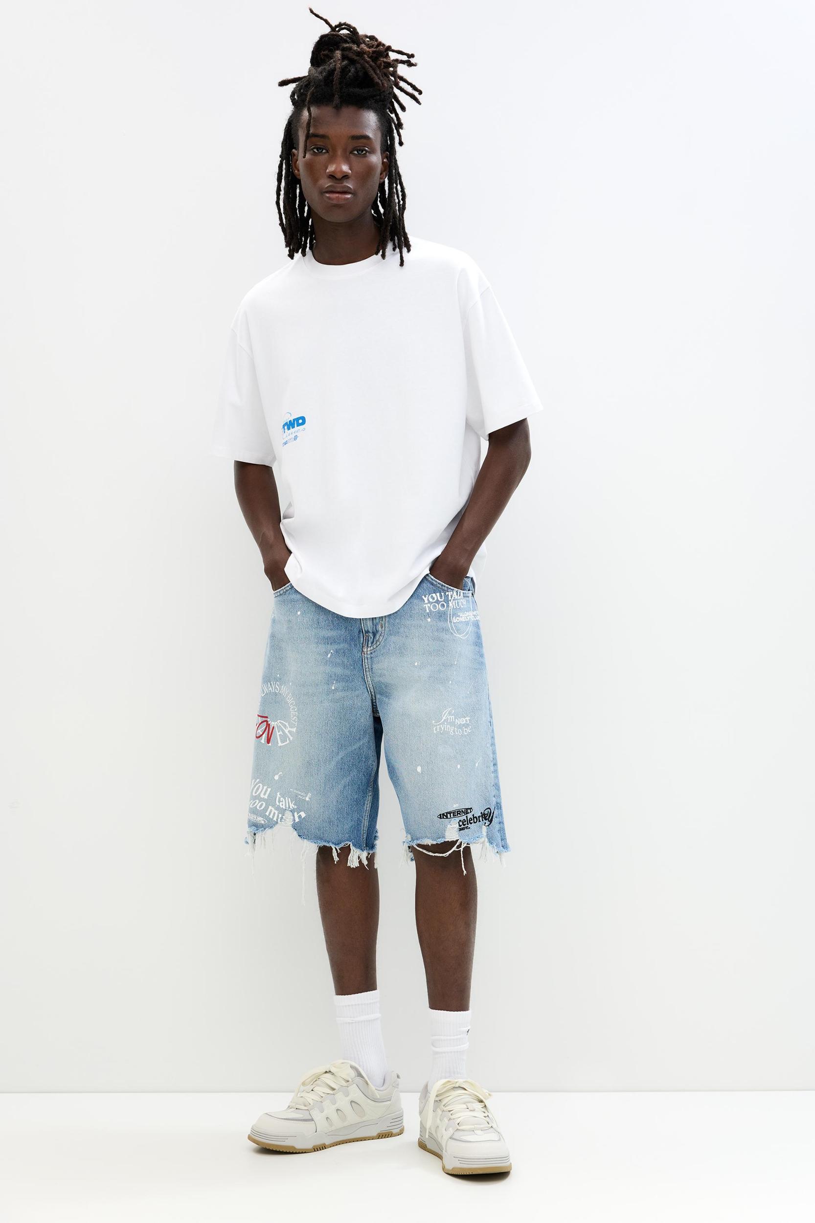 Ripped denim Bermuda shorts Product Image