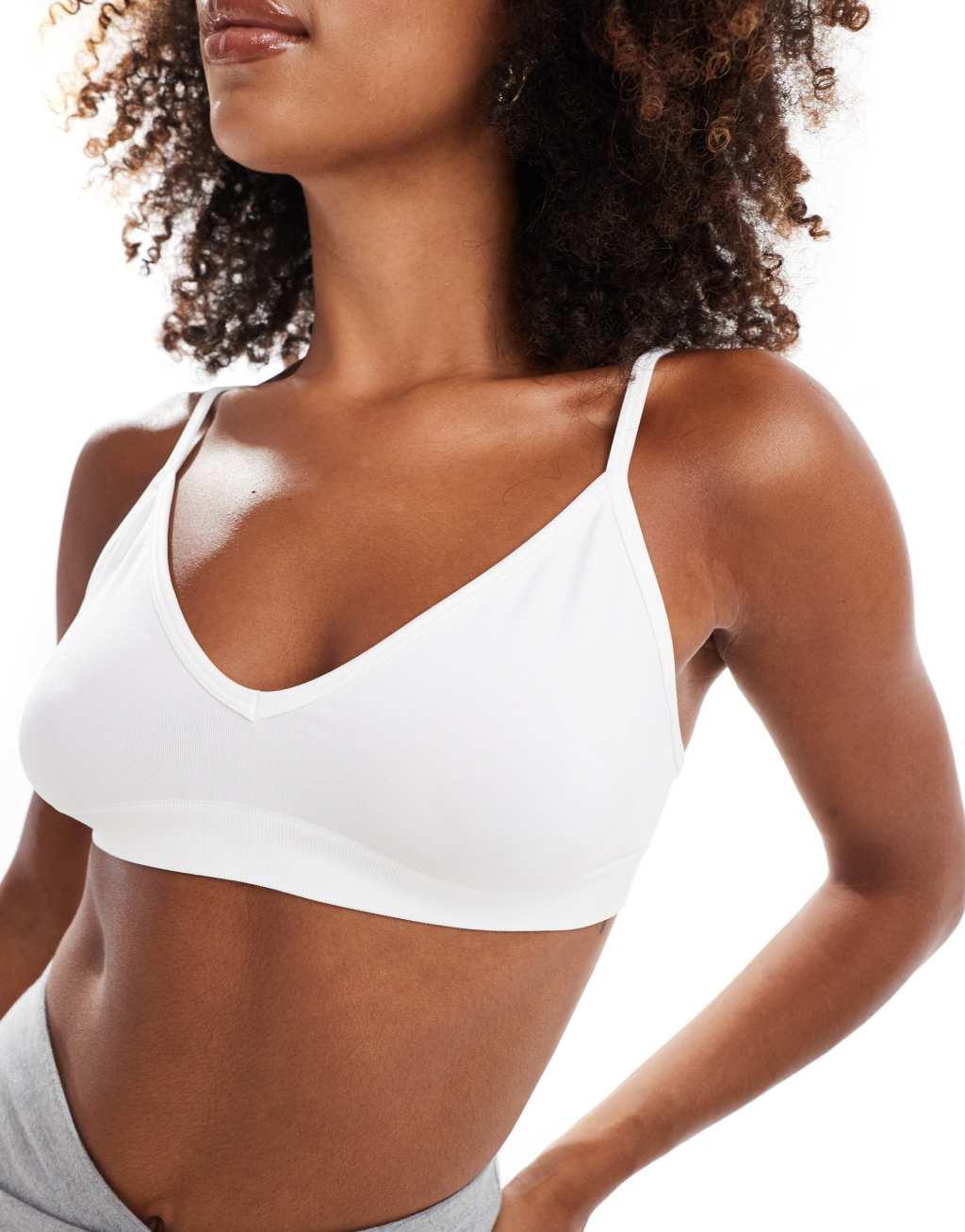 ASOS 4505 Icon seamless active intimate light support sports bra in white Product Image