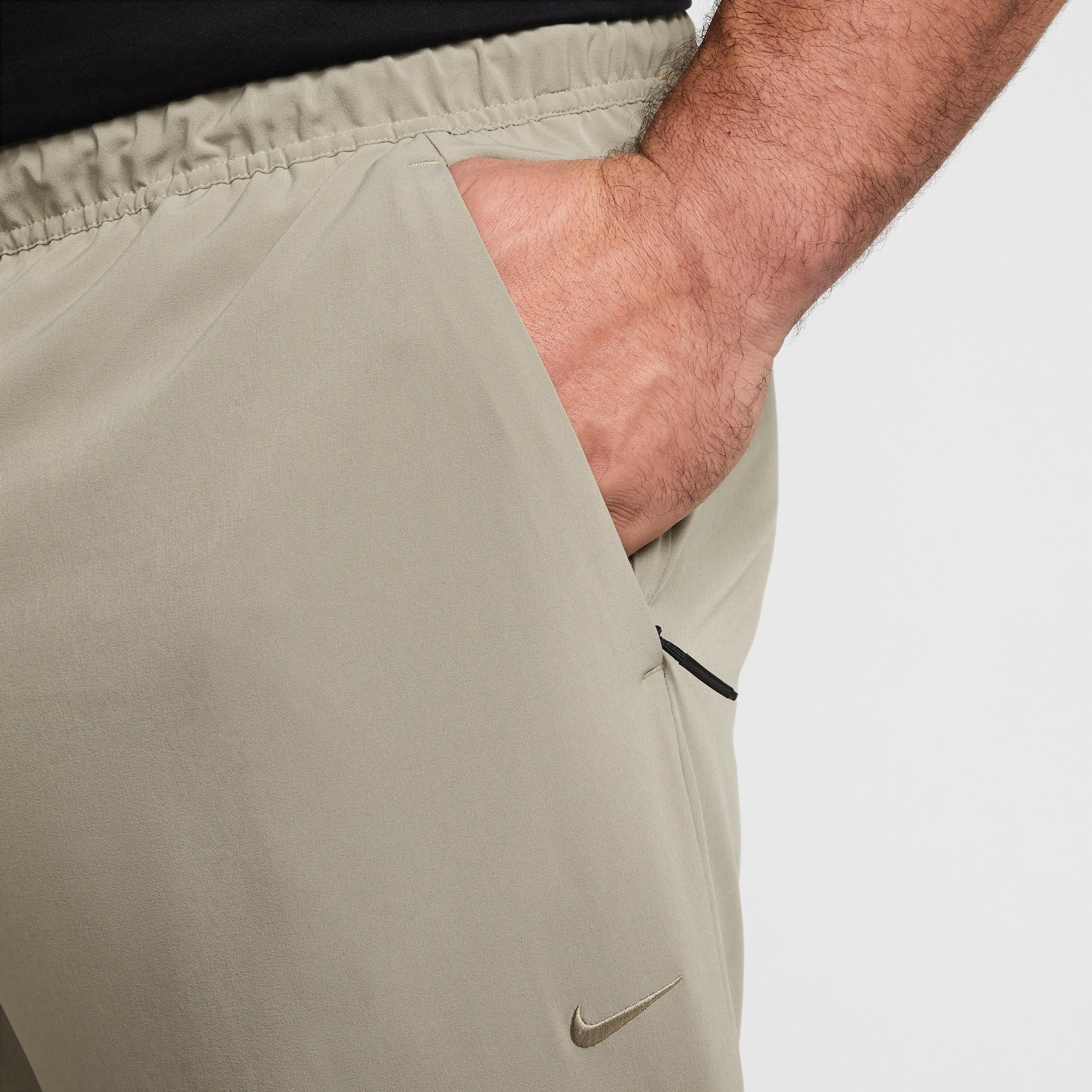 Nike Mens Unlimited Dri-FIT Zippered Cuff Versatile Pants | FB7548-320 Product Image