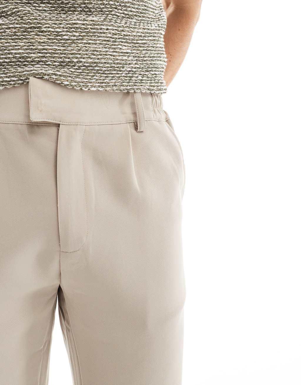 The Couture Club trousers with split hem in beige Product Image