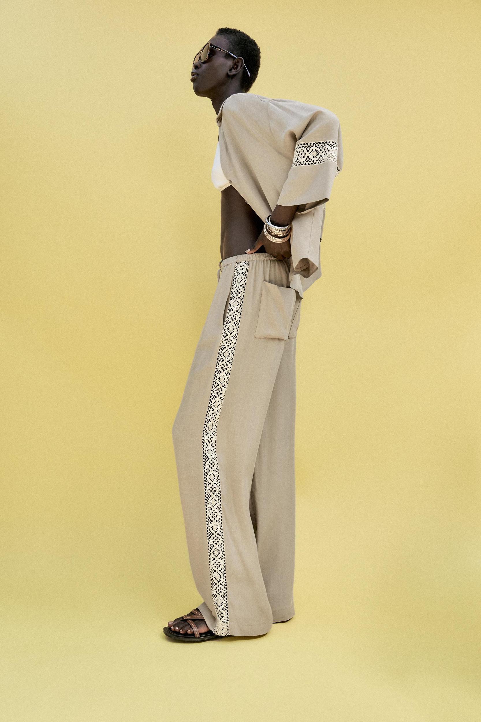 WIDE LEG PANTS WITH EMBROIDERED SIDE STRIPES Product Image