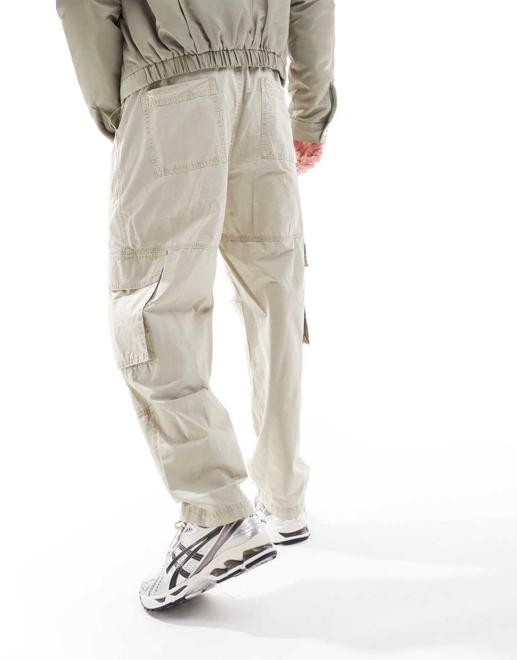 ASOS DESIGN washed baggy cargo pants with panel detailing in stone Product Image