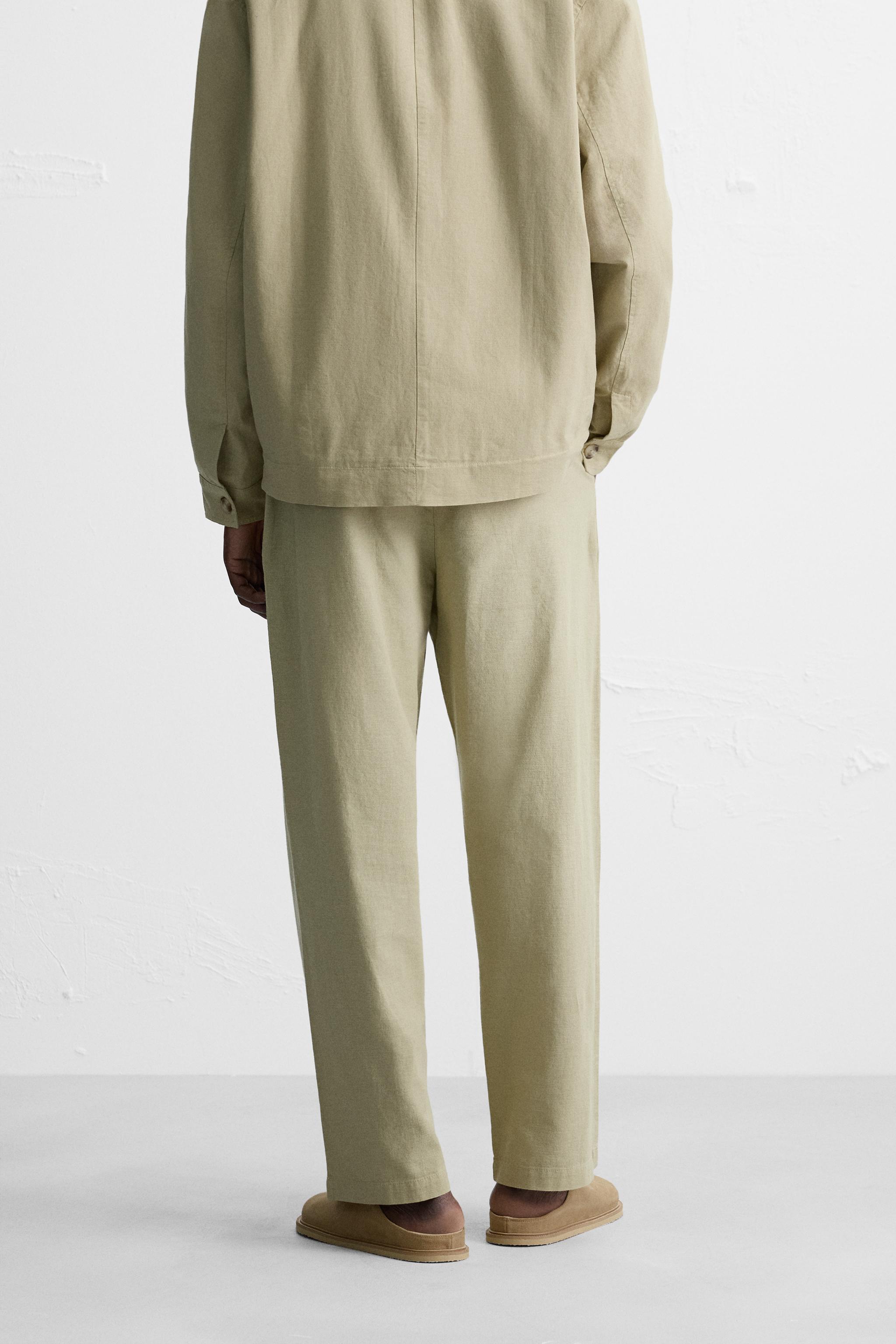 RELAXED FIT PLEATED PANTS Product Image