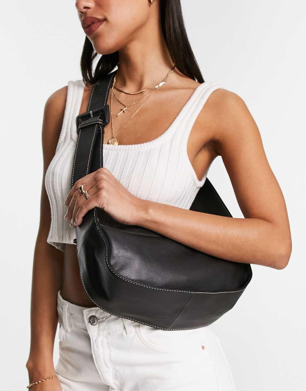 ASOS DESIGN leather curved base crossbody sling bag with contrast stitch in black Product Image