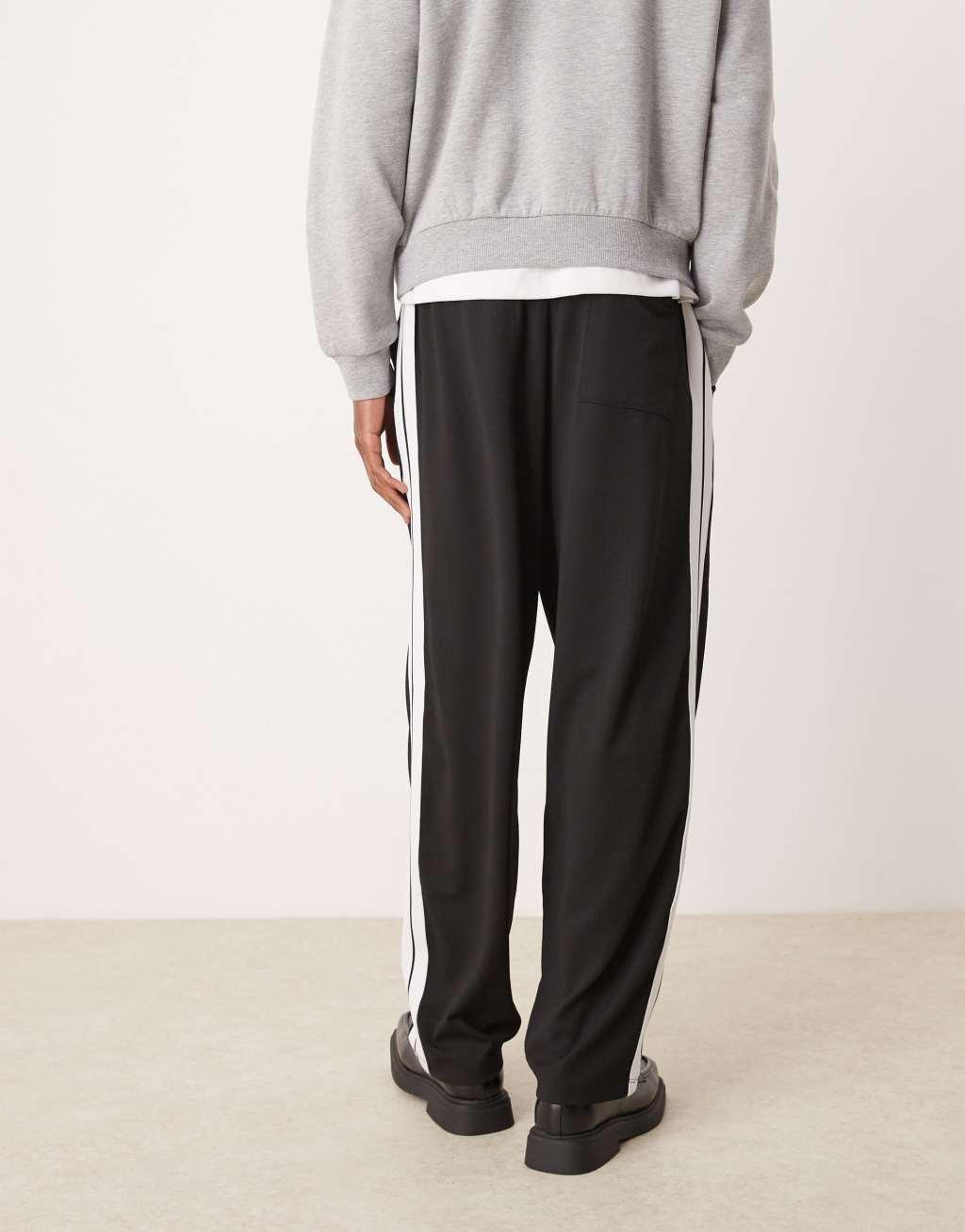 ASOS DESIGN super baggy smart sweatpants with taping in black Product Image