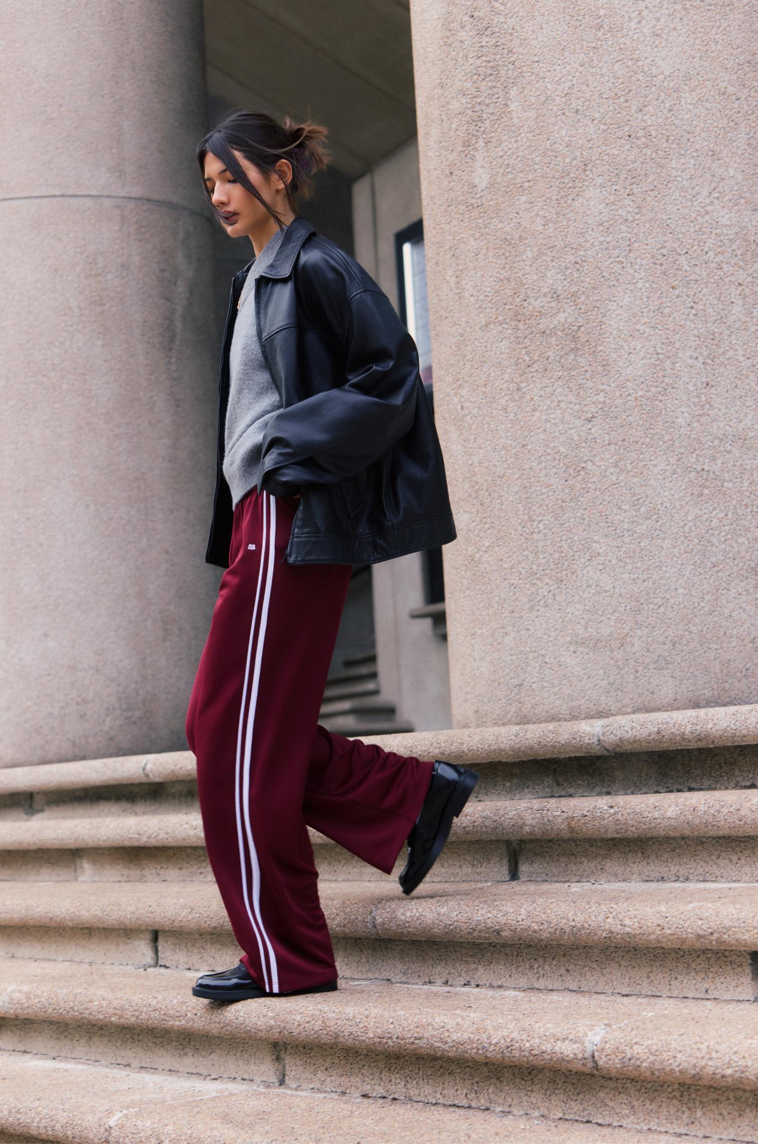 Tracksuit pants with side stripes Product Image