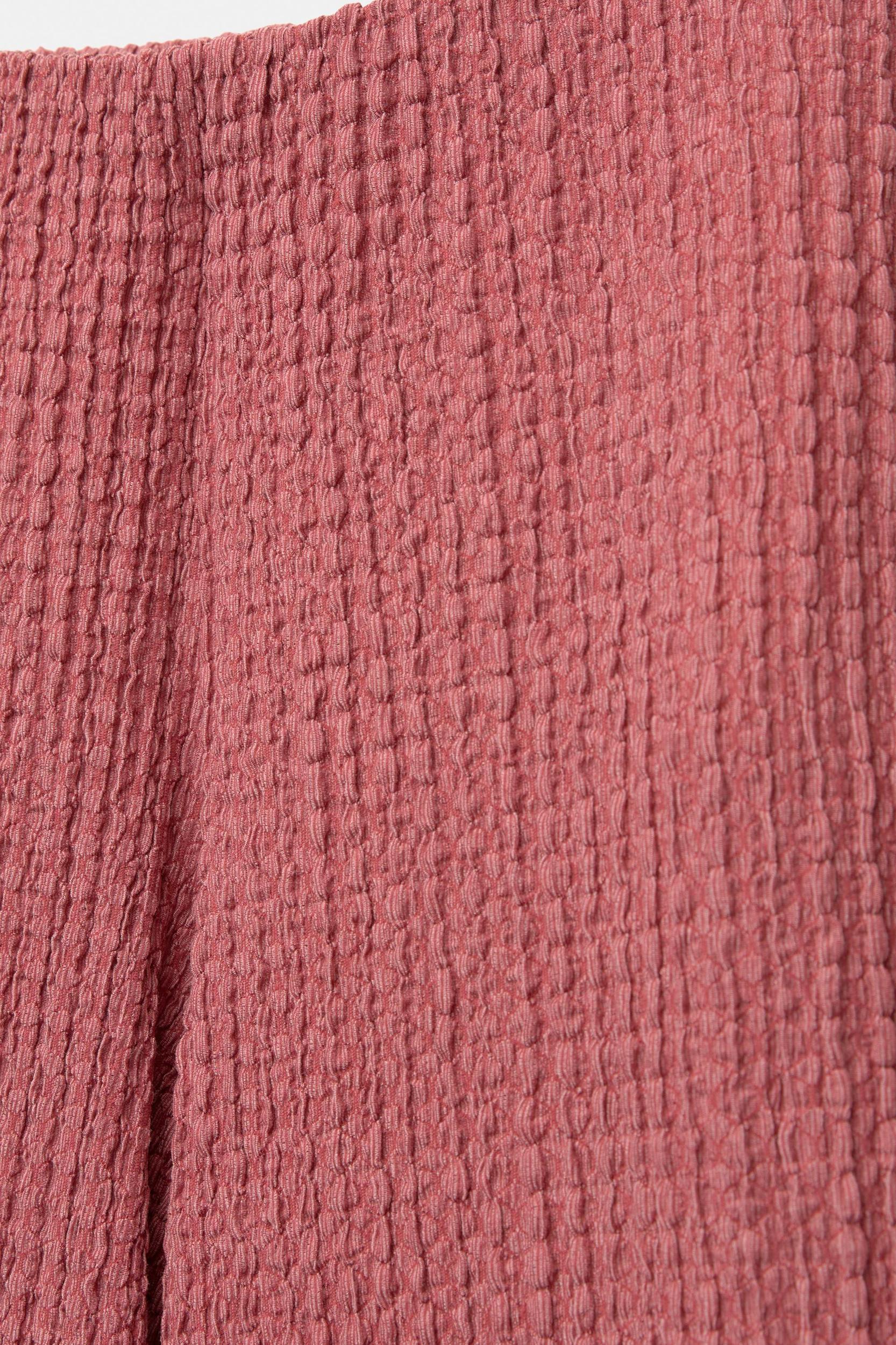 Rustic creased-effect pants Product Image