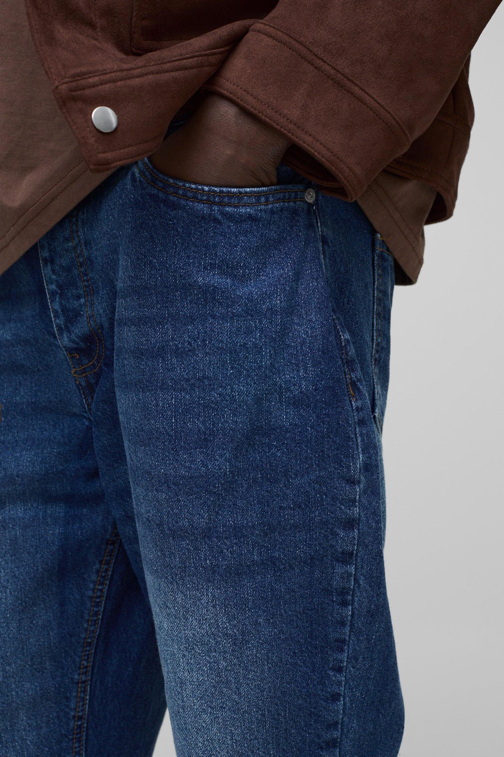 Relaxed Rigid Flare Jean In Mid Blue | boohooMAN USA Product Image