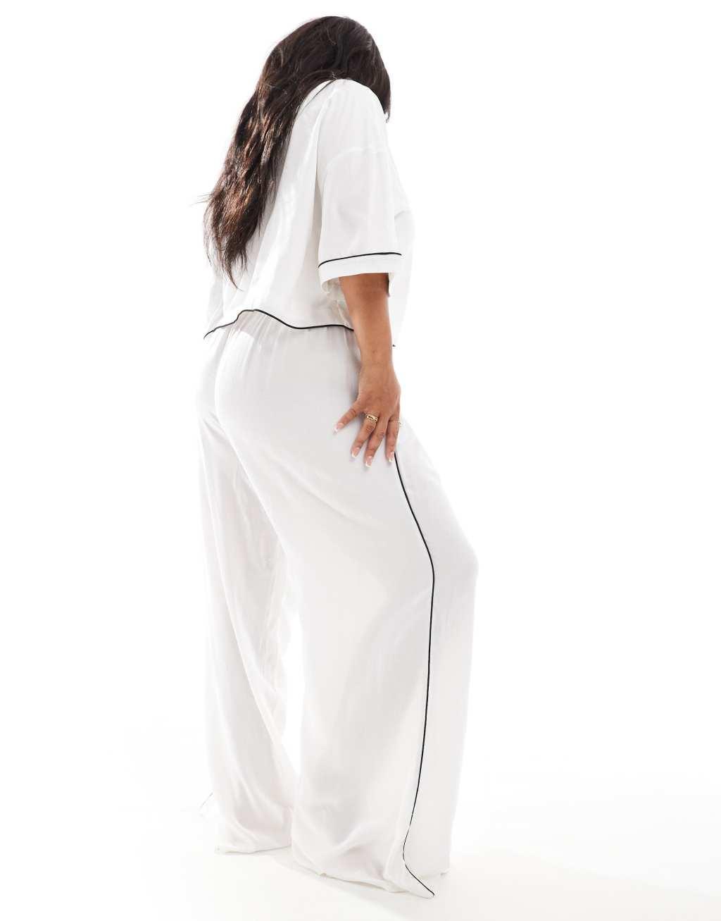 ASOS DESIGN Curve super soft slinky wide leg pajama pants in white with contrast binding Product Image