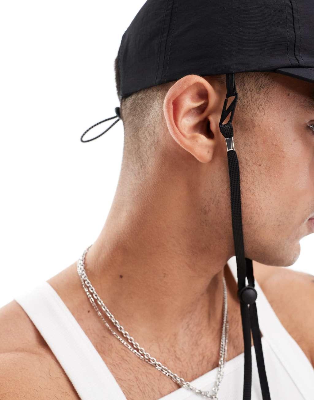 ASOS DESIGN nylon cap with drawstring in black Product Image