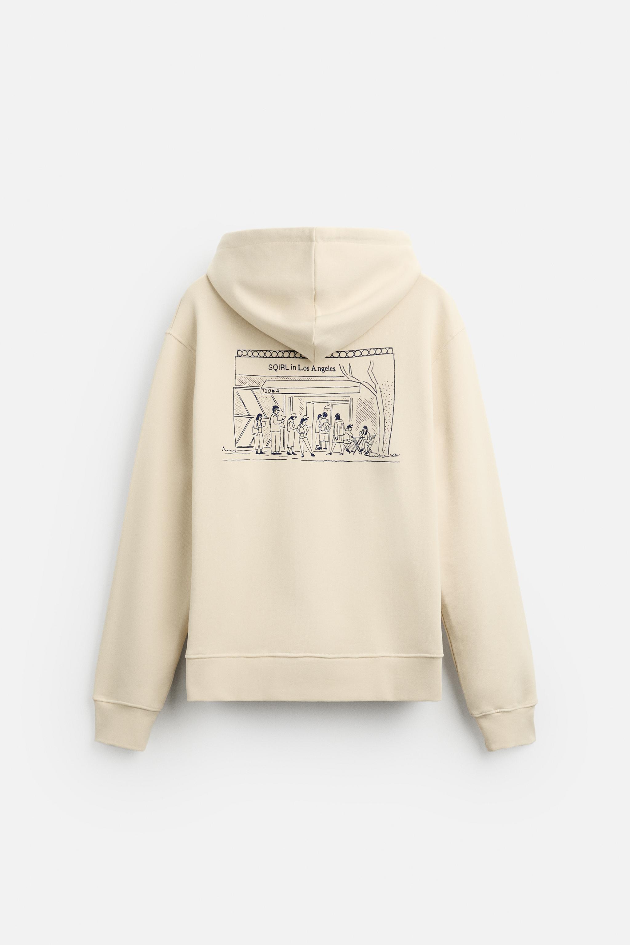 GRAPHIC “SQIRL” HOODIE SWEATSHIRT Product Image