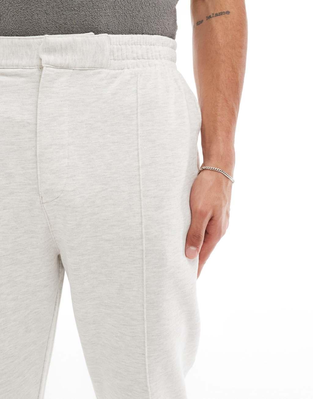 ASOS DESIGN tapered sweatpants with zip fastening in heather gray Product Image