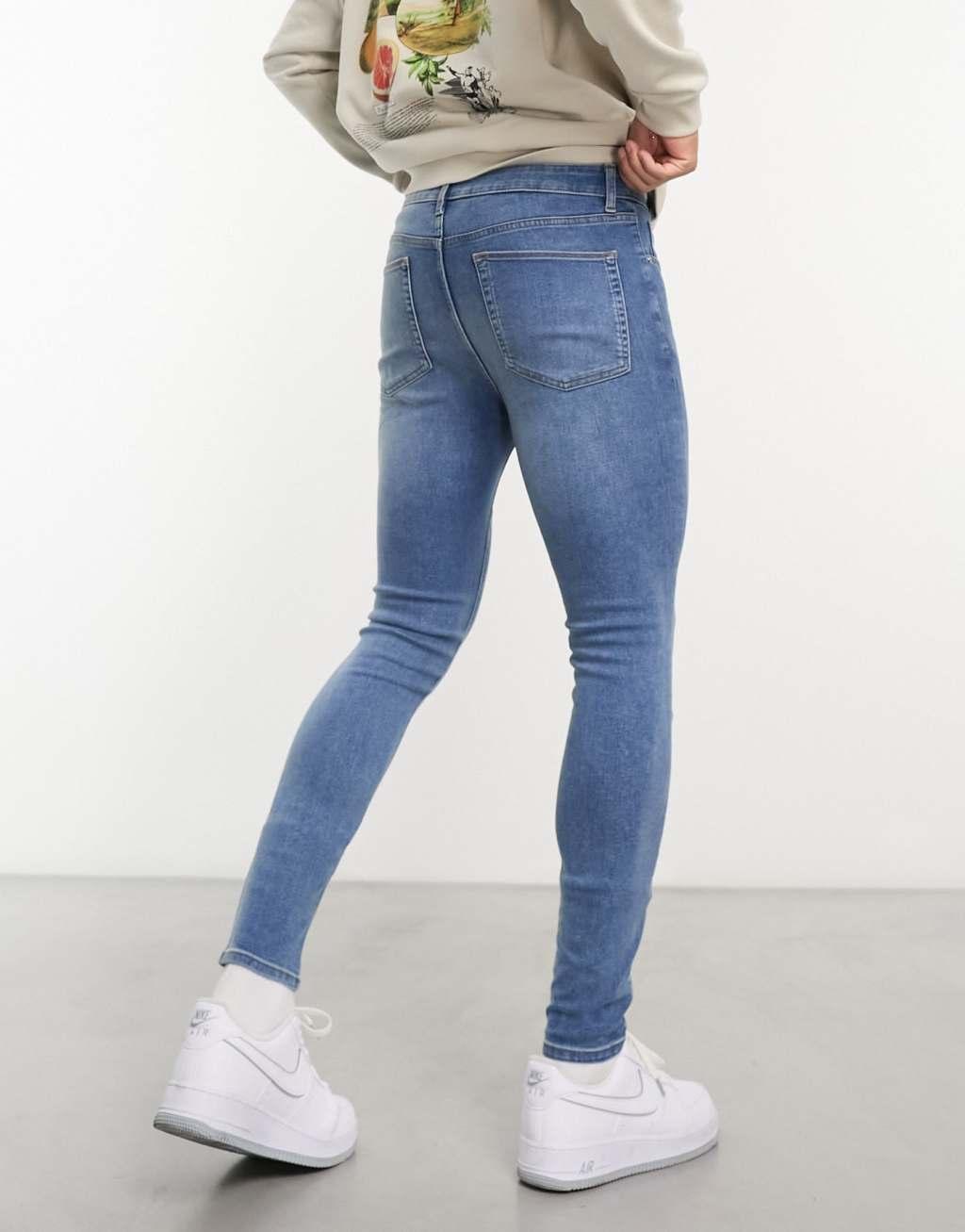 ASOS DESIGN power stretch jeans in mid wash blue Product Image