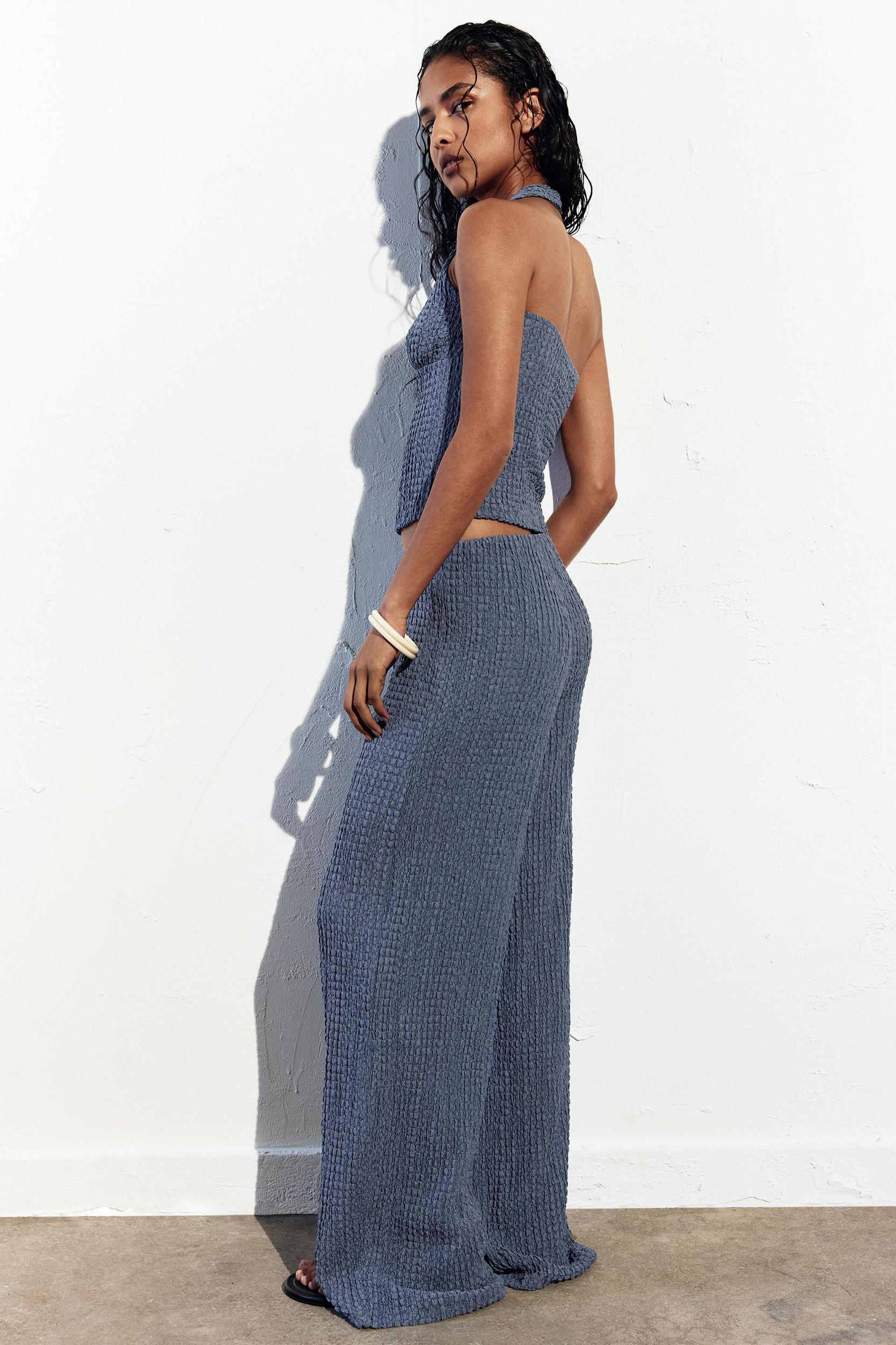 Rustic creased-effect pants Product Image