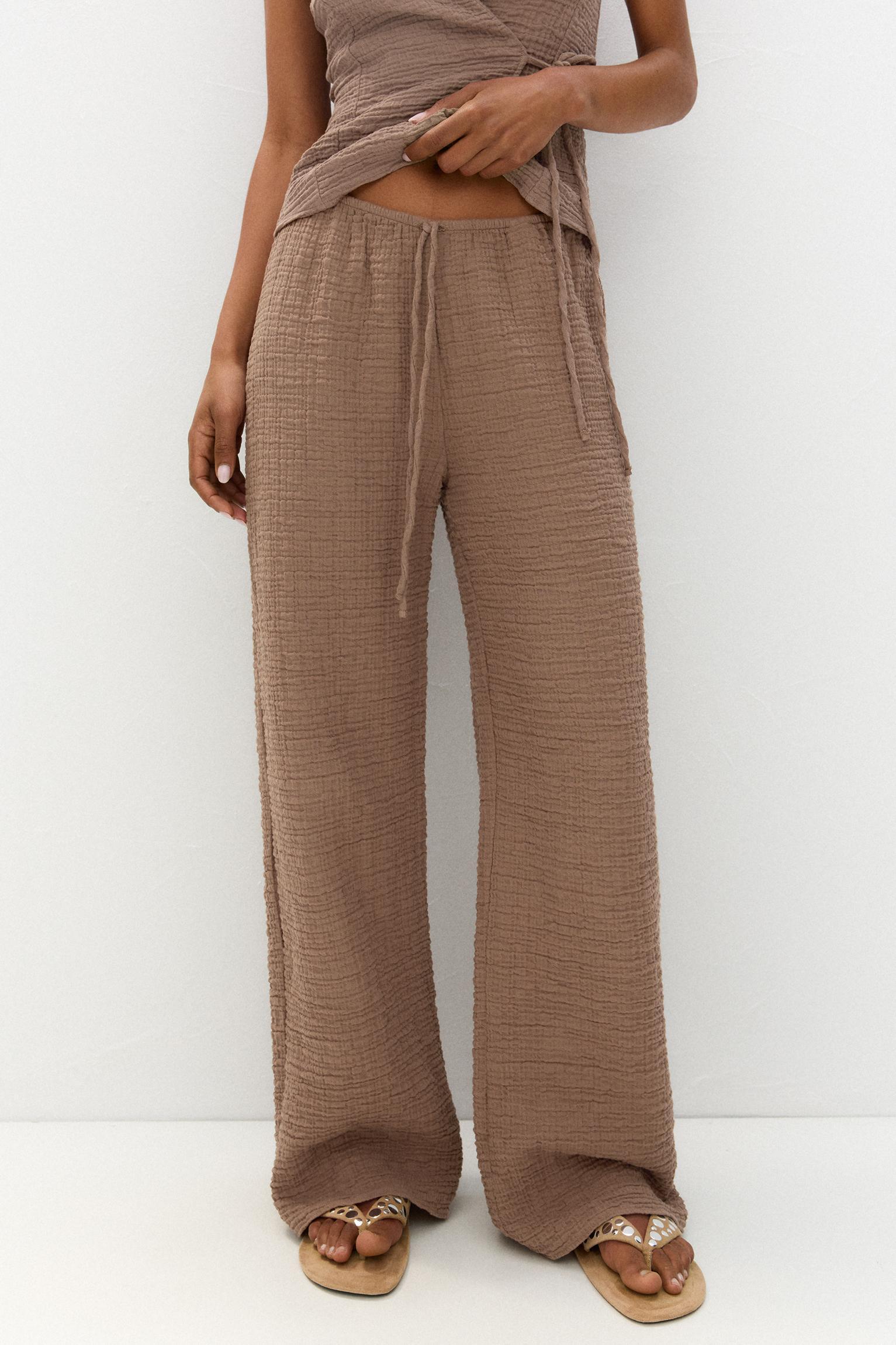 Rustic creased-effect pants Product Image