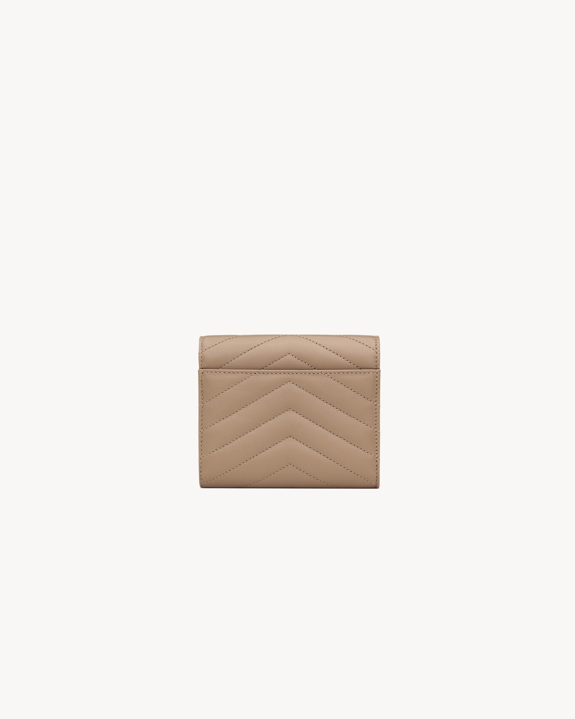 CASSANDRE MATELASSÉ compact tri fold wallet in grain de poudre leather Product Image