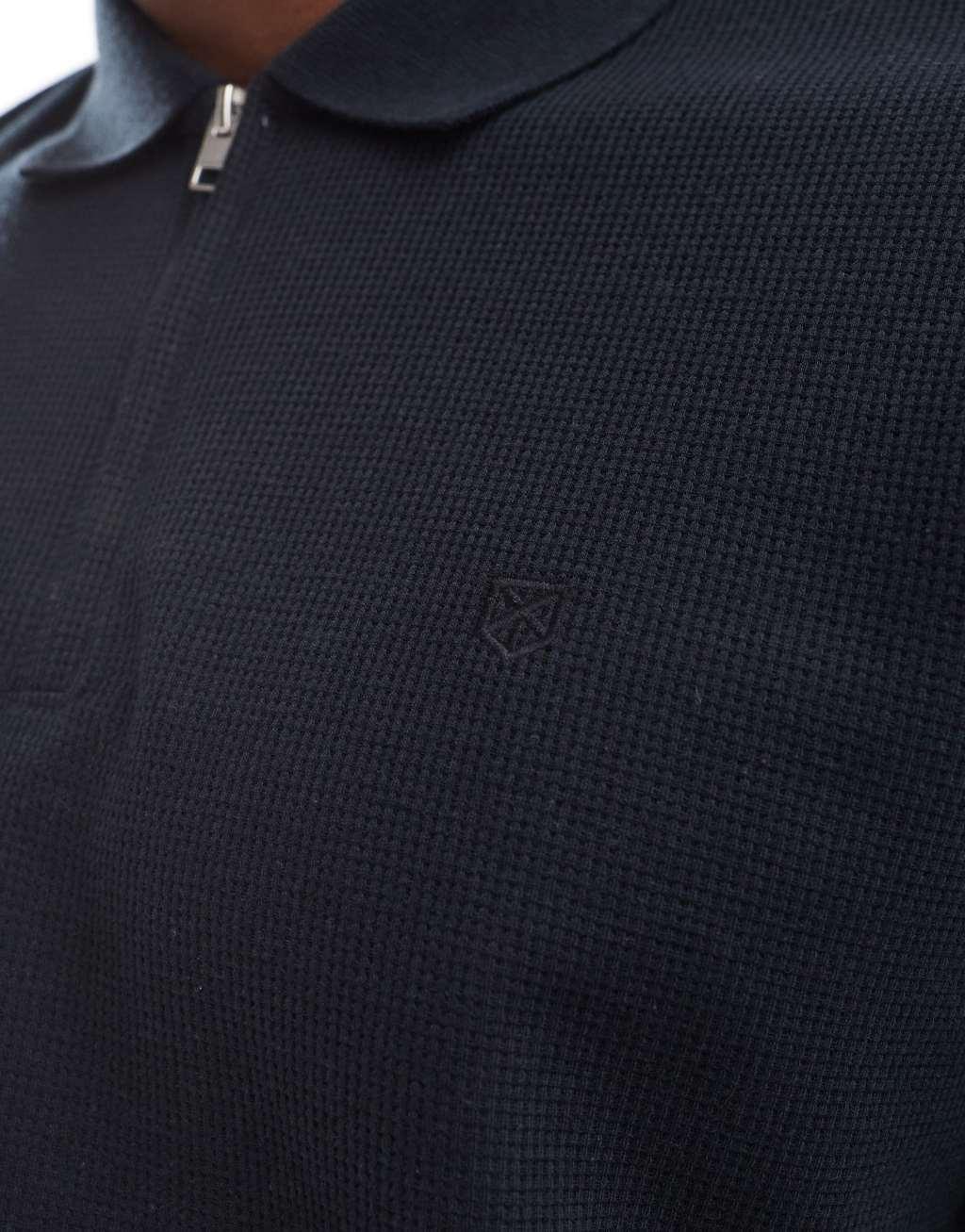 Jack & Jones waffle zip up polo in black Product Image