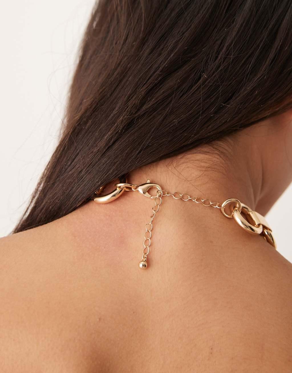 ASOS DESIGN choker necklace with chunky ring detail in gold tone Product Image