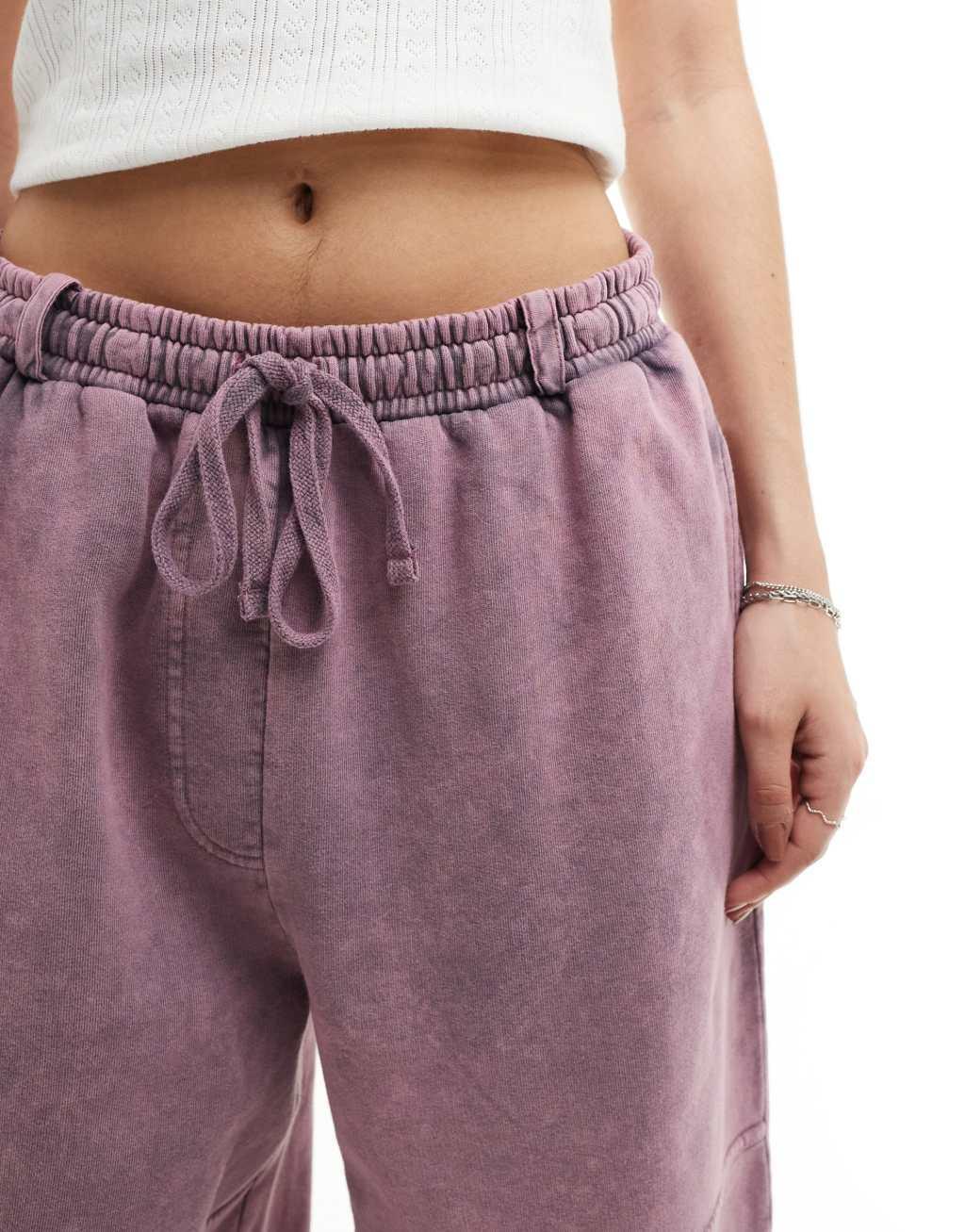 ASOS DESIGN straight leg sweatpants with seam details in pink acid wash Product Image