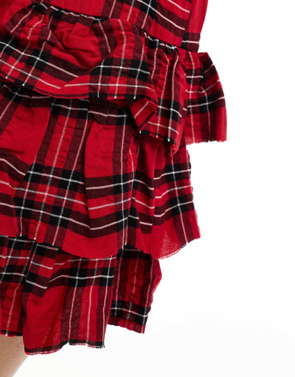 Bershka ruffled tiered mini skirt in red & black plaid Product Image