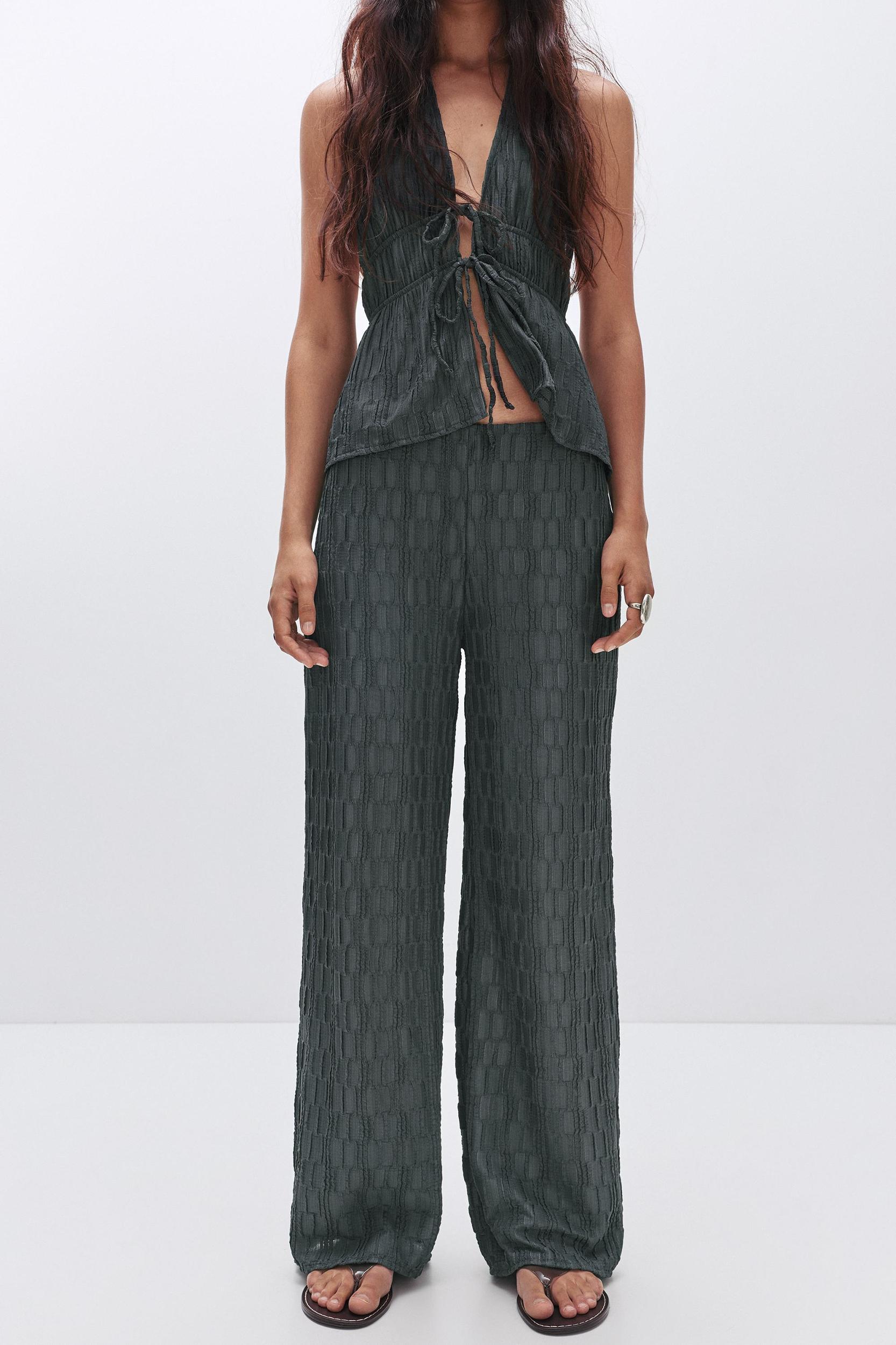 Textured bell bottom trousers Product Image