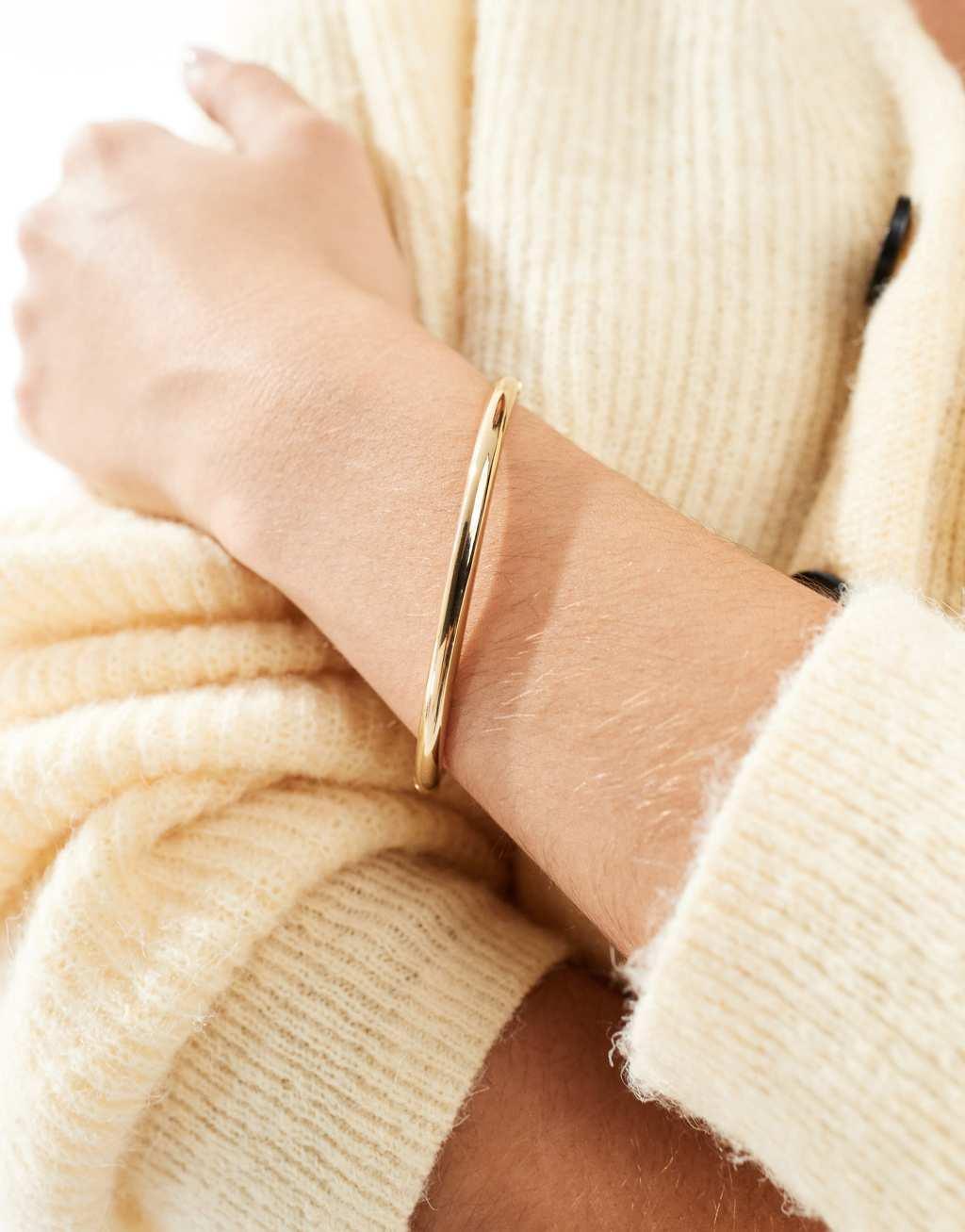 ASOS DESIGN waterproof stainless steel simple bangle in gold tone Product Image